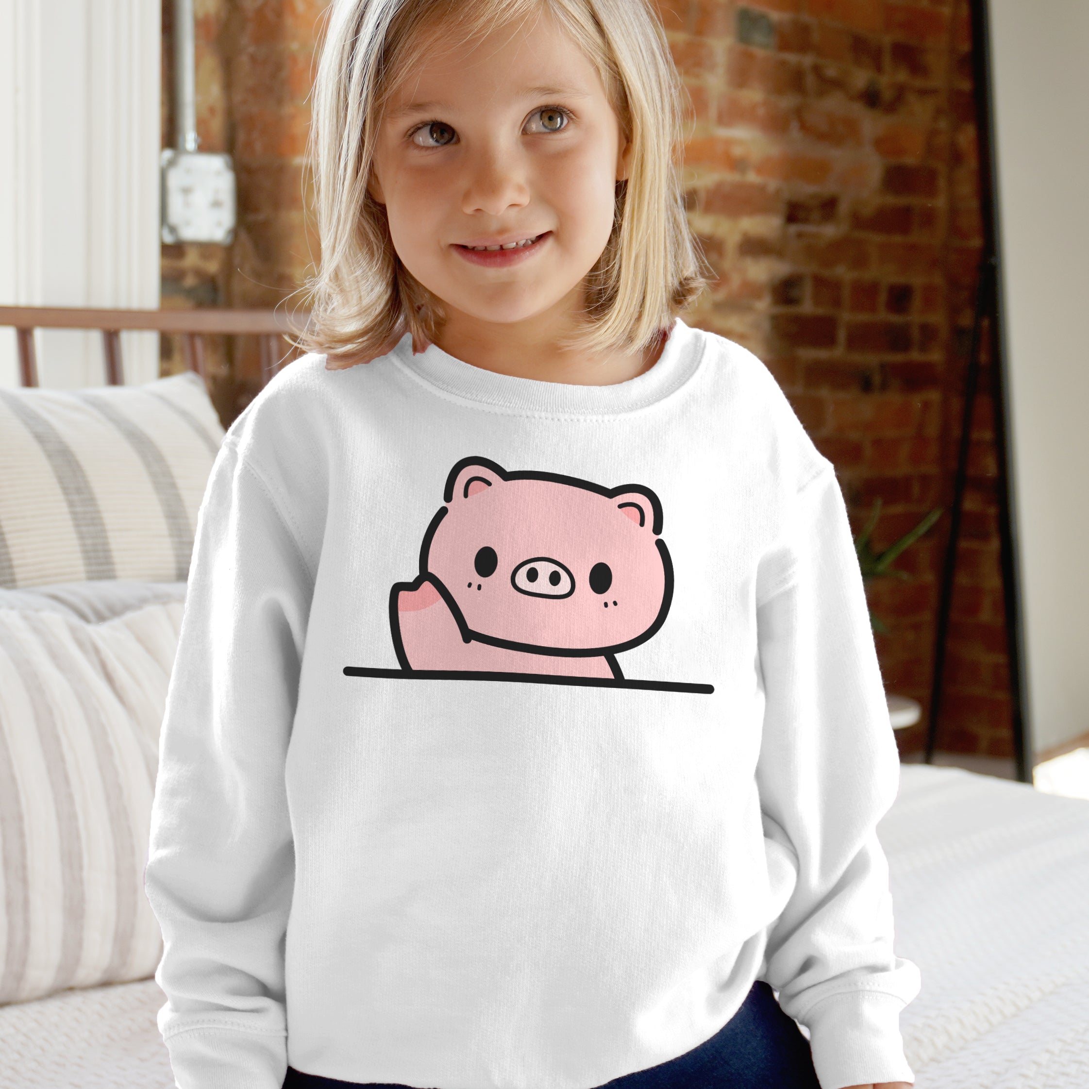 White long-sleeved sweatshirt with a pink cartoon pig design for kids featuring soft cotton fabric