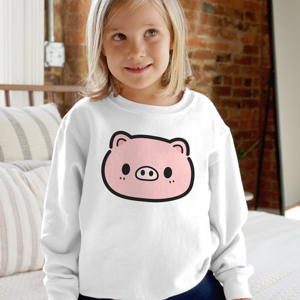 Kids pink pig sweatshirt featuring a white long-sleeved cotton sweatshirt with a pink cartoon pig face print