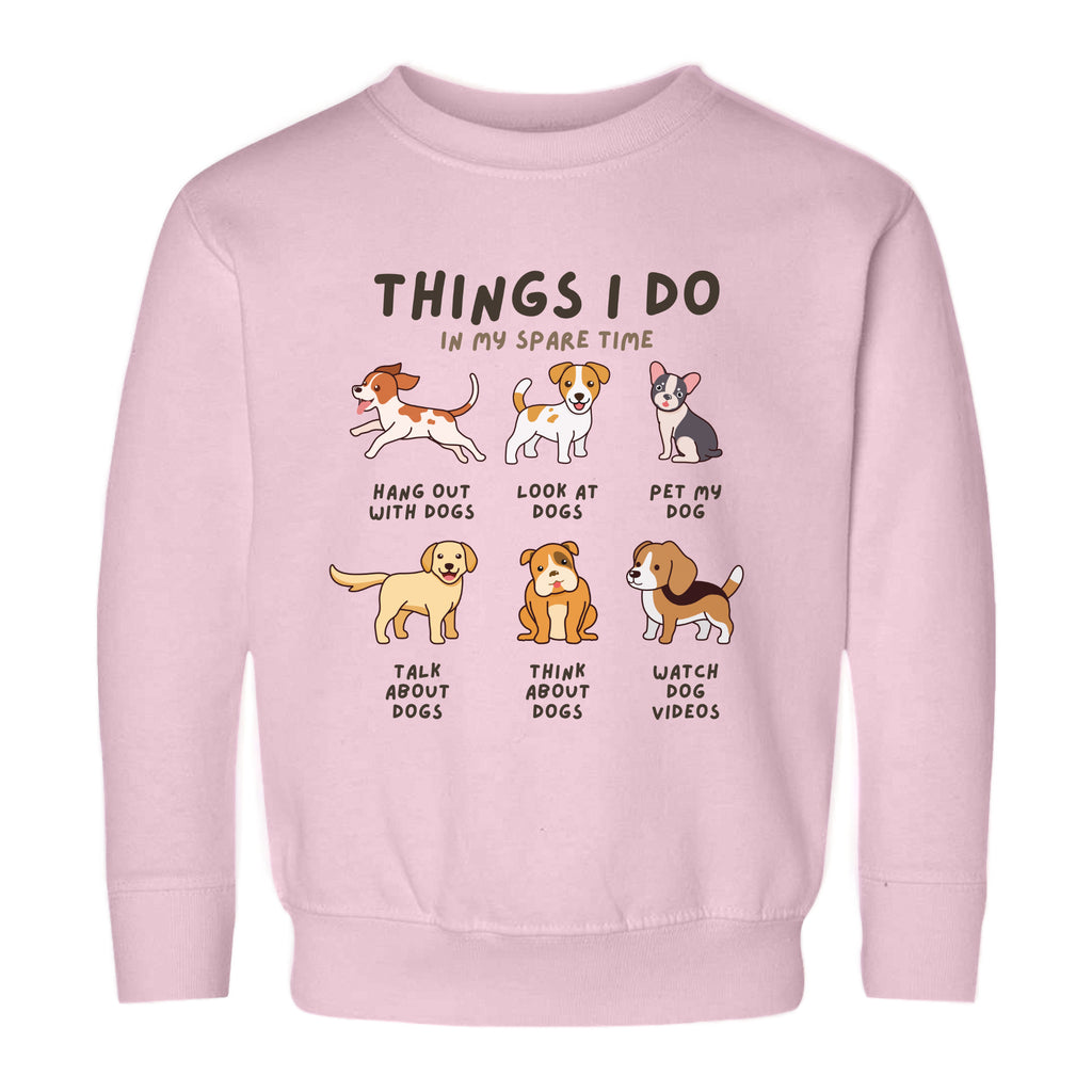 pink sweatshirt with text and illustrations of dogs, indicating favorite activities 'Things I Do In My Spare Time'.