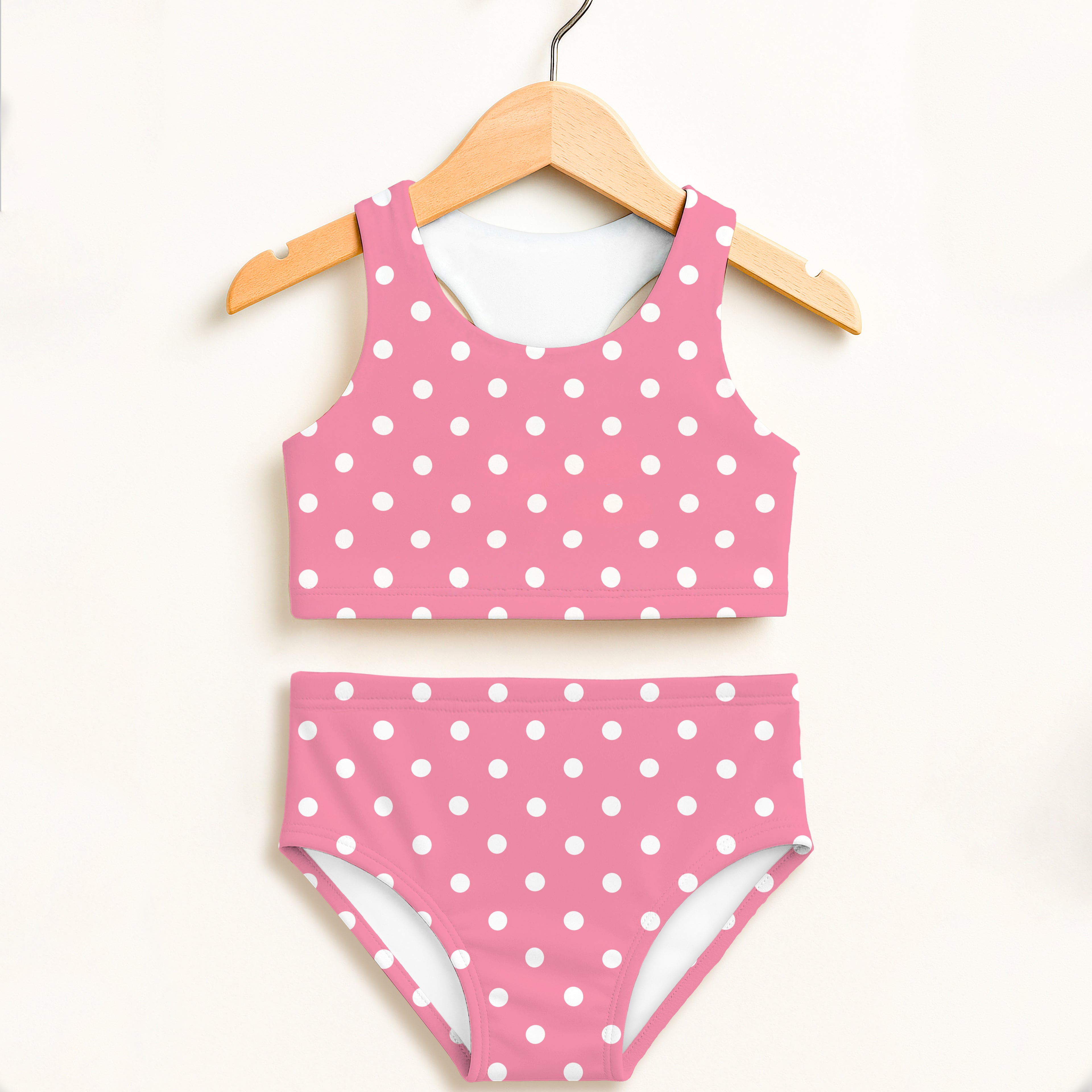 Girls pink polka dot two piece swimsuit with white dots double layered high waisted UPF 50 plus comfort
