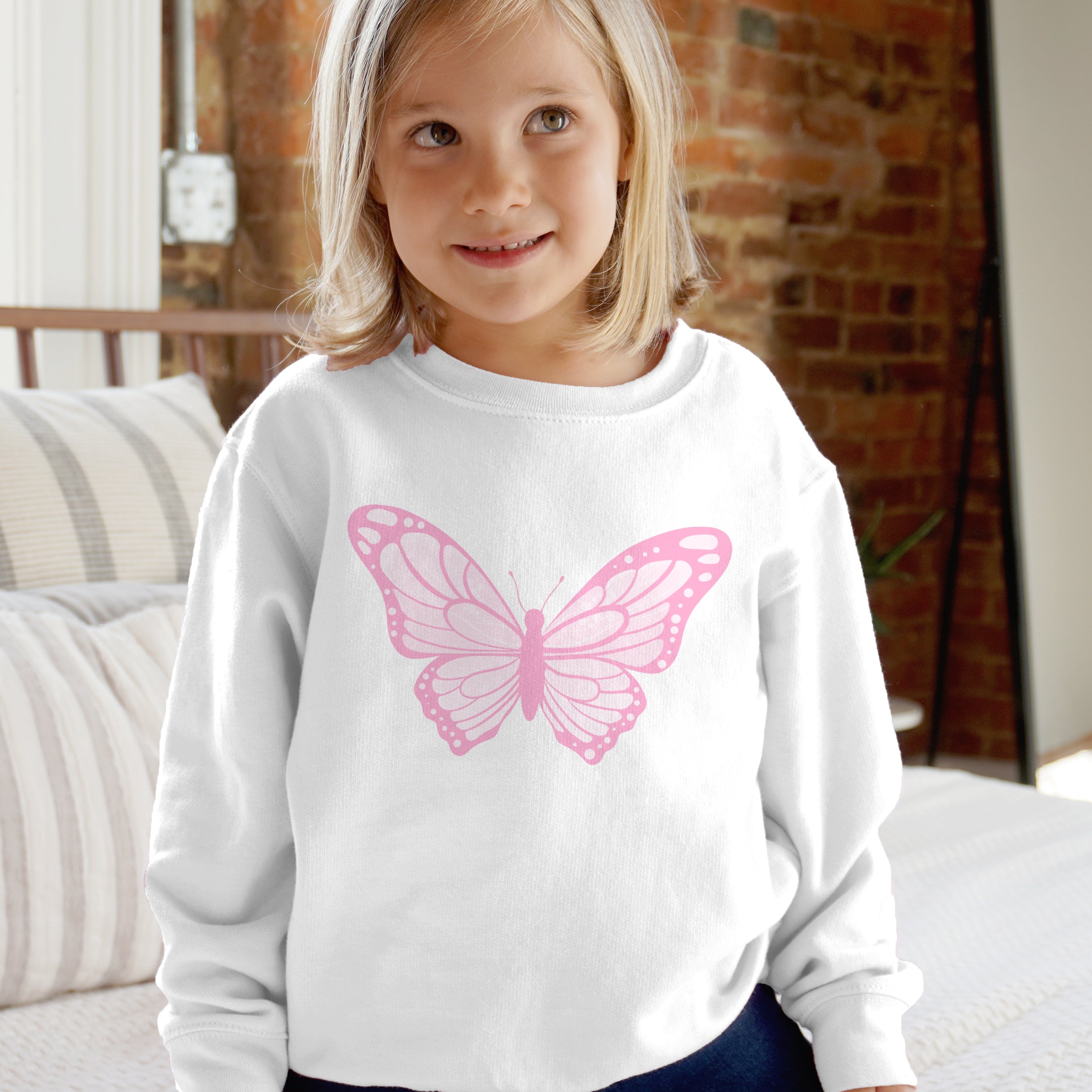 White long-sleeved sweatshirt for kids with a pink pastel butterfly graphic on the front perfect for casual wear