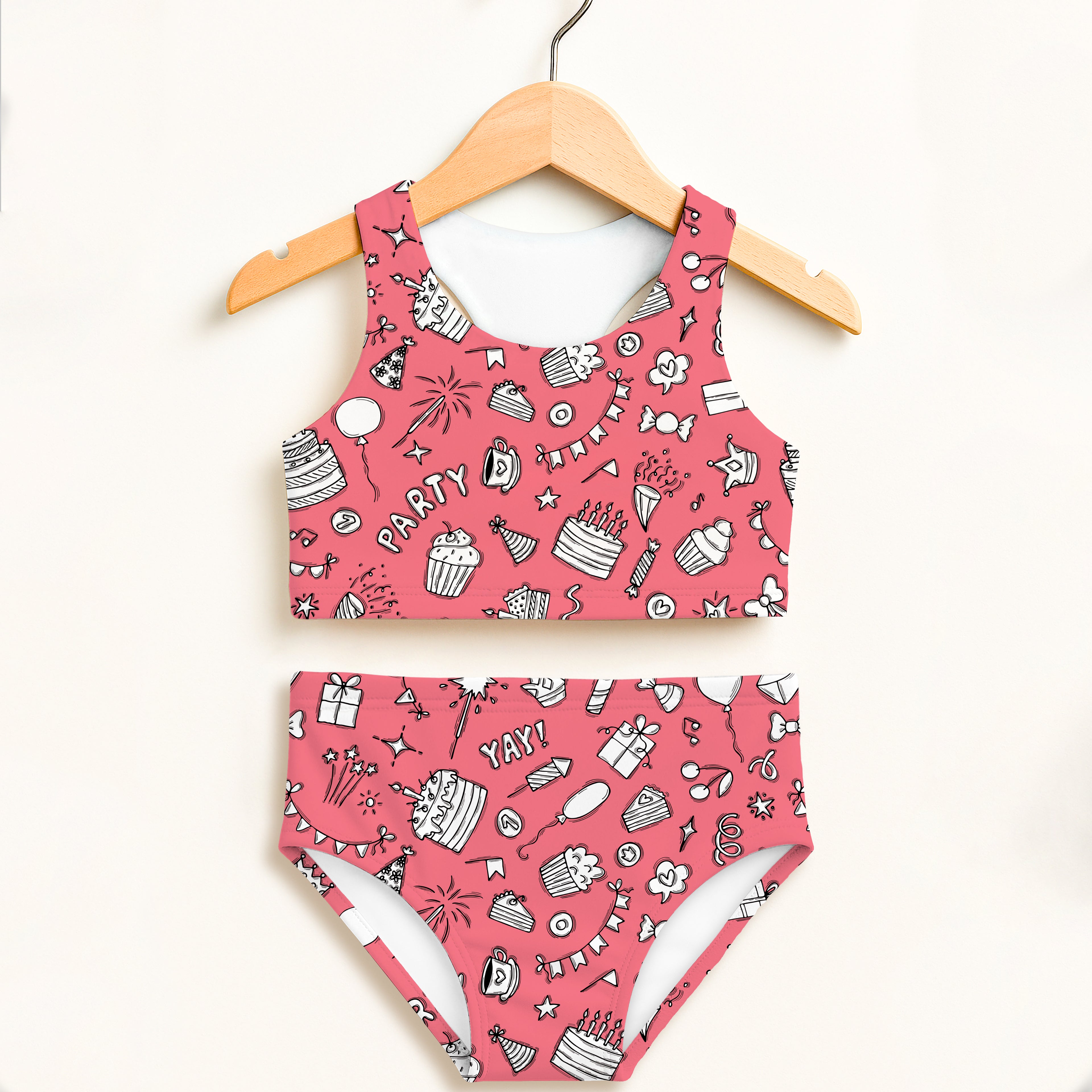 Girls pink birthday party themed two piece swimsuit with playful cupcake print double layered upf 50 plus high waisted comfort