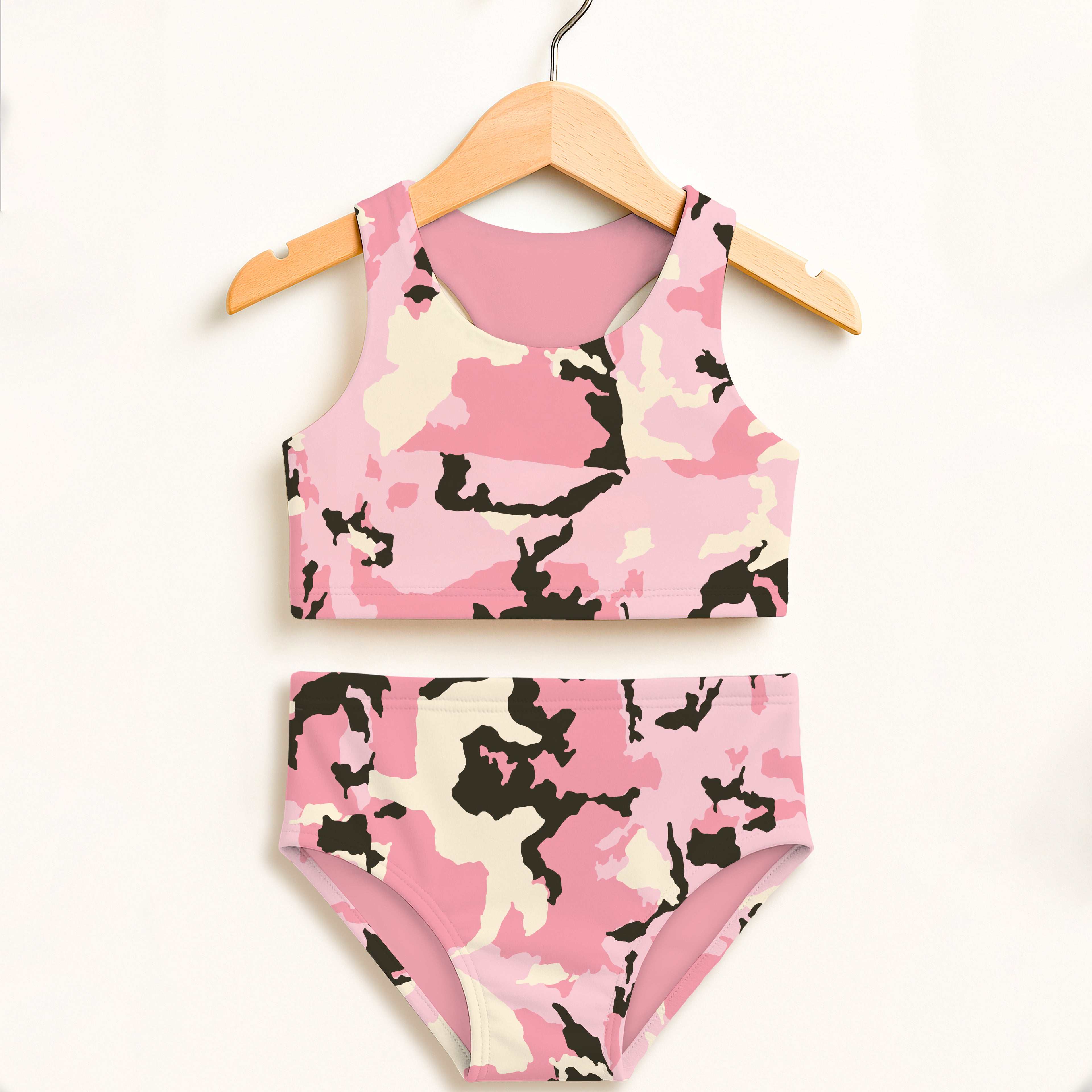 Girls pink camo two piece swimsuit with black and pink camouflage pattern, solid pink lining, and upf 50+ protection