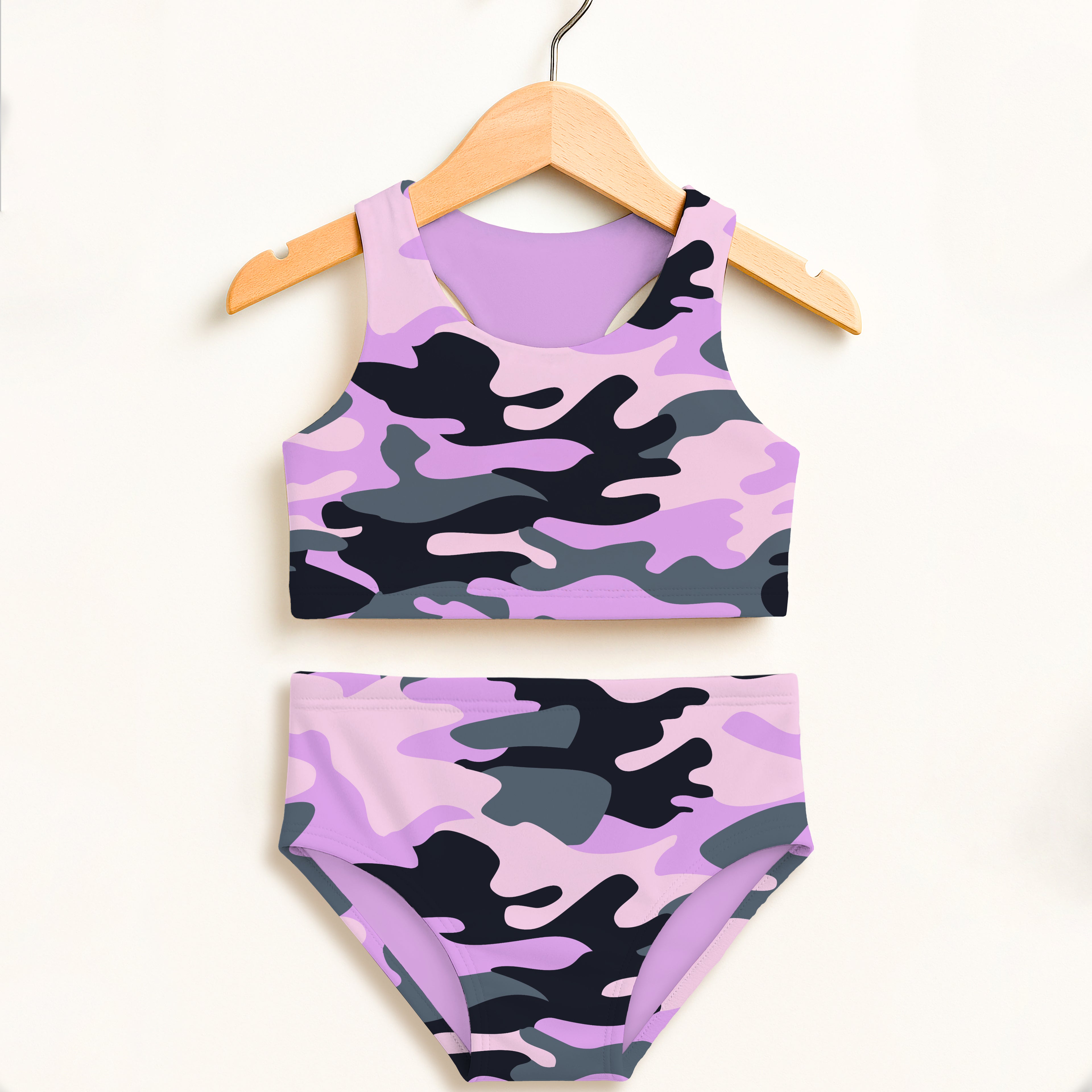 Girls purple and black camouflage two piece swimsuit set with double layered fabric and upf 50 plus protection