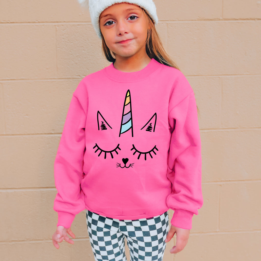 Girls caticorn sweatshirt in pink with a rainbow horn and closed-eye cat face design for casual wear