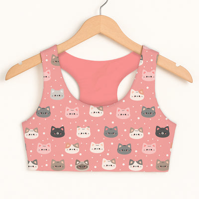 Girls cute pink cat faces sports bra with soft stretchy fabric and playful gray white and black cartoon faces design
