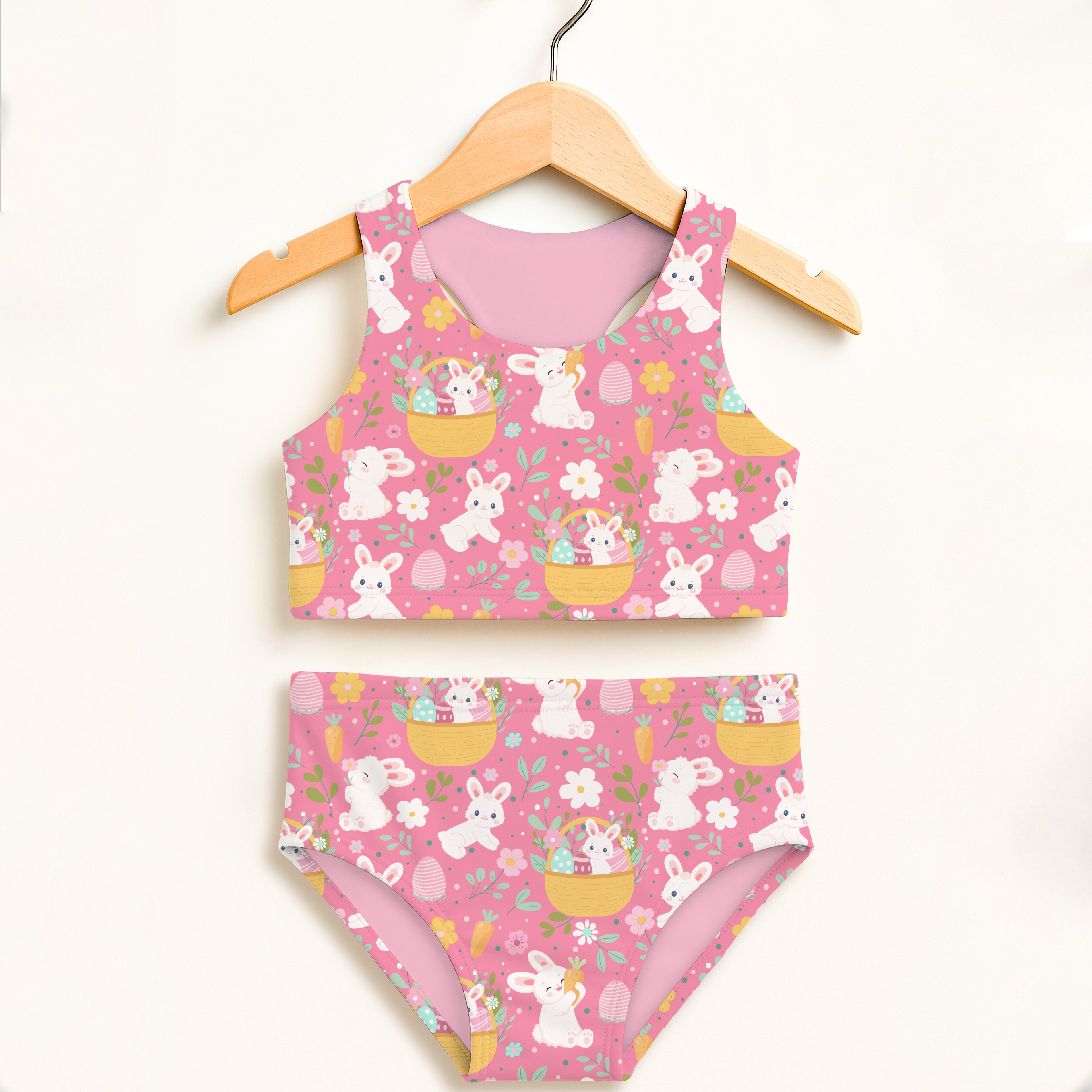 Girls pink Easter rabbits two-piece swimsuit with yellow baskets pastel floral accents and UPF 50 plus protection
