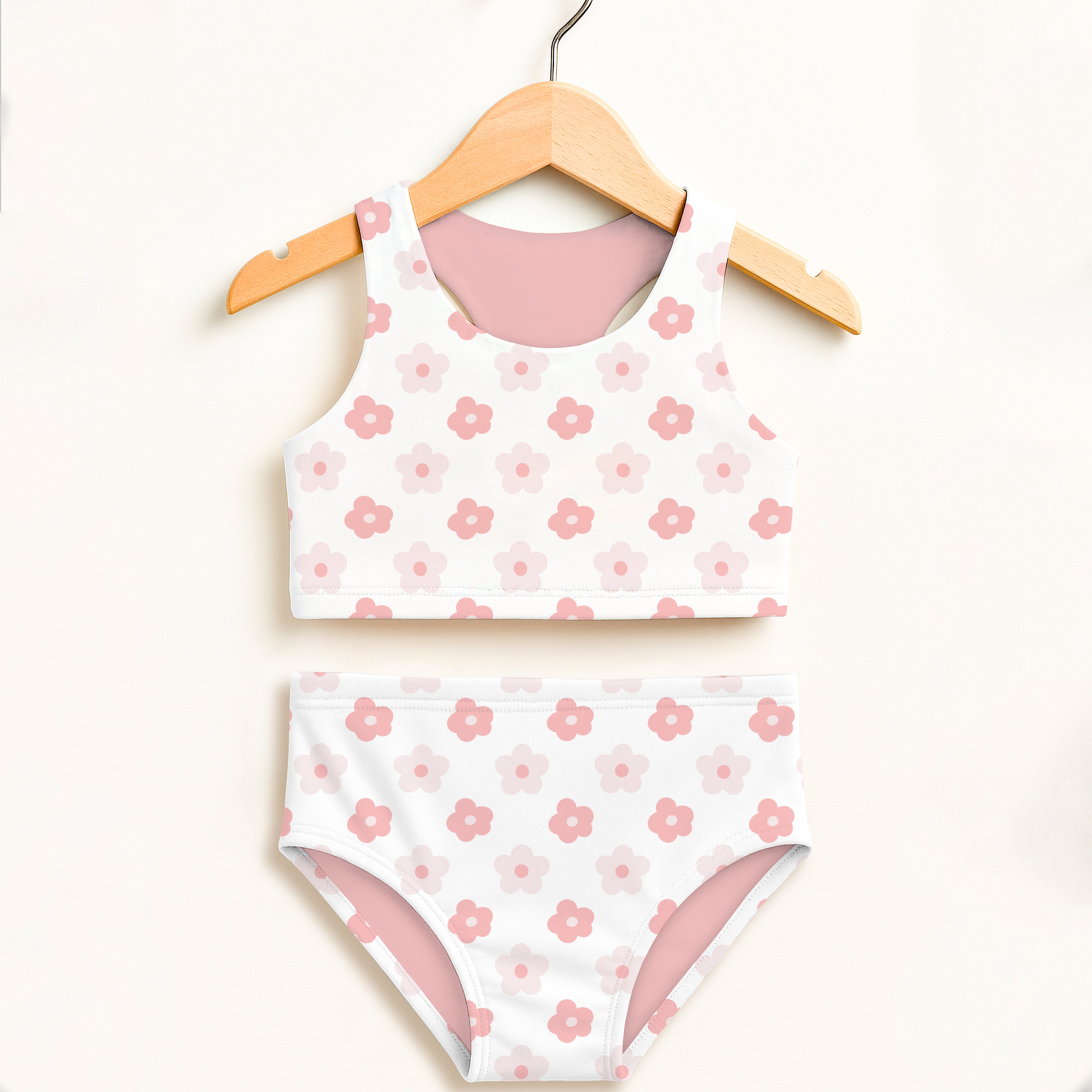 Girls white two piece swimsuit with pink floral pattern and lining on wooden hanger double layered upf 50 high waisted comfort