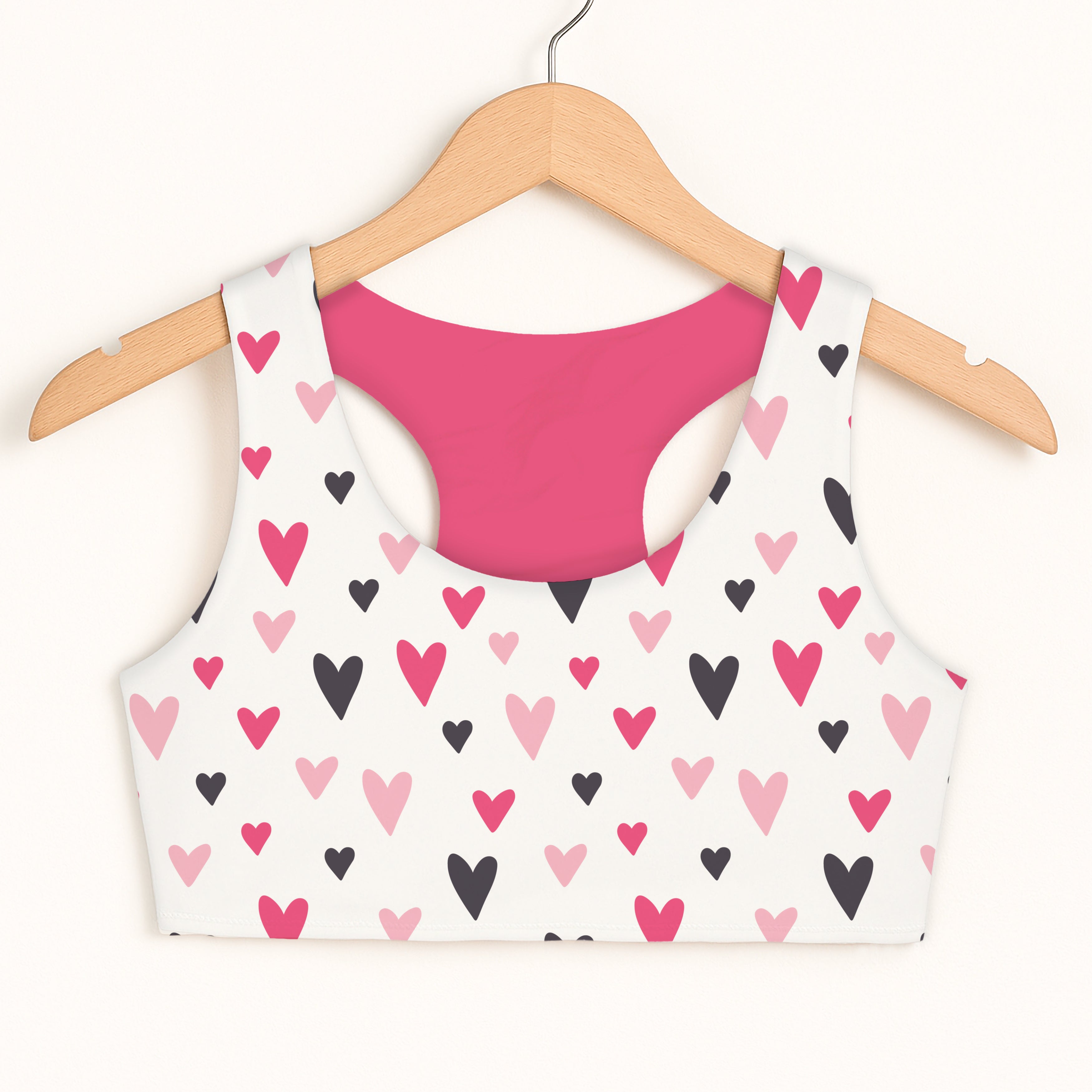 Girls Valentine’s Day hearts white sports bra with pink and black heart pattern and quick drying magenta lining
