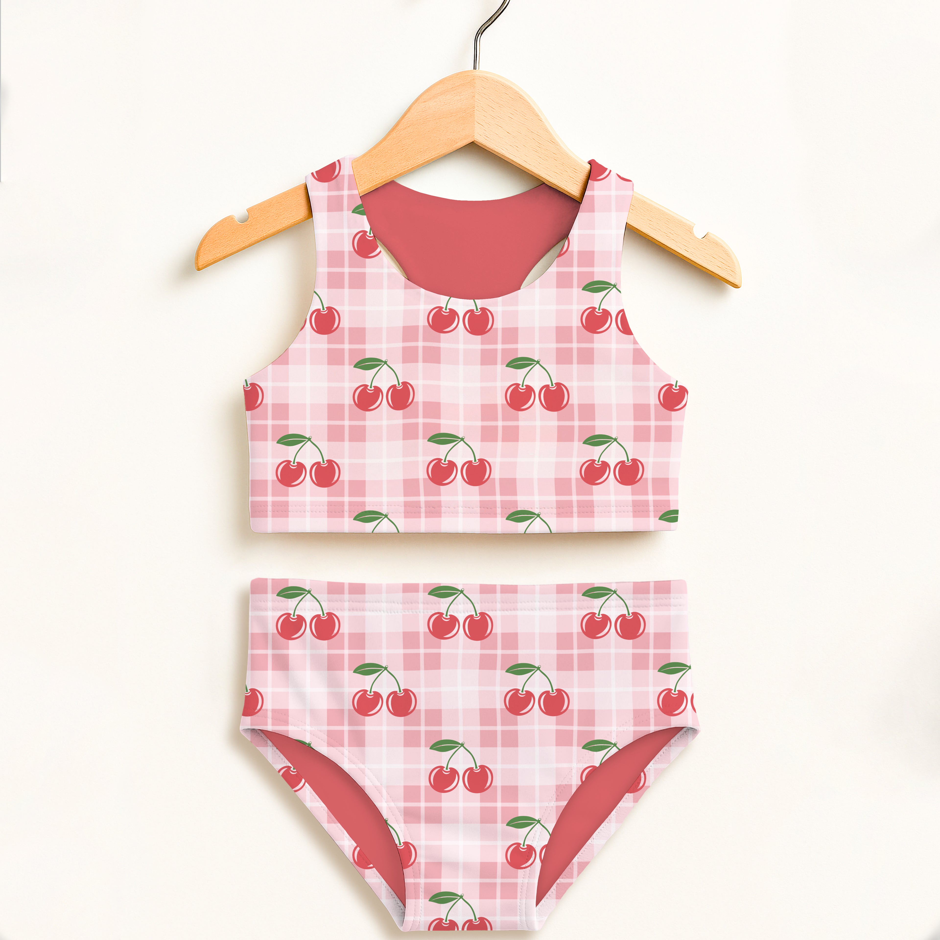 Girls pink gingham cherry two piece swimsuit with plaid pattern and solid red lining double layered upf 50+ high waisted