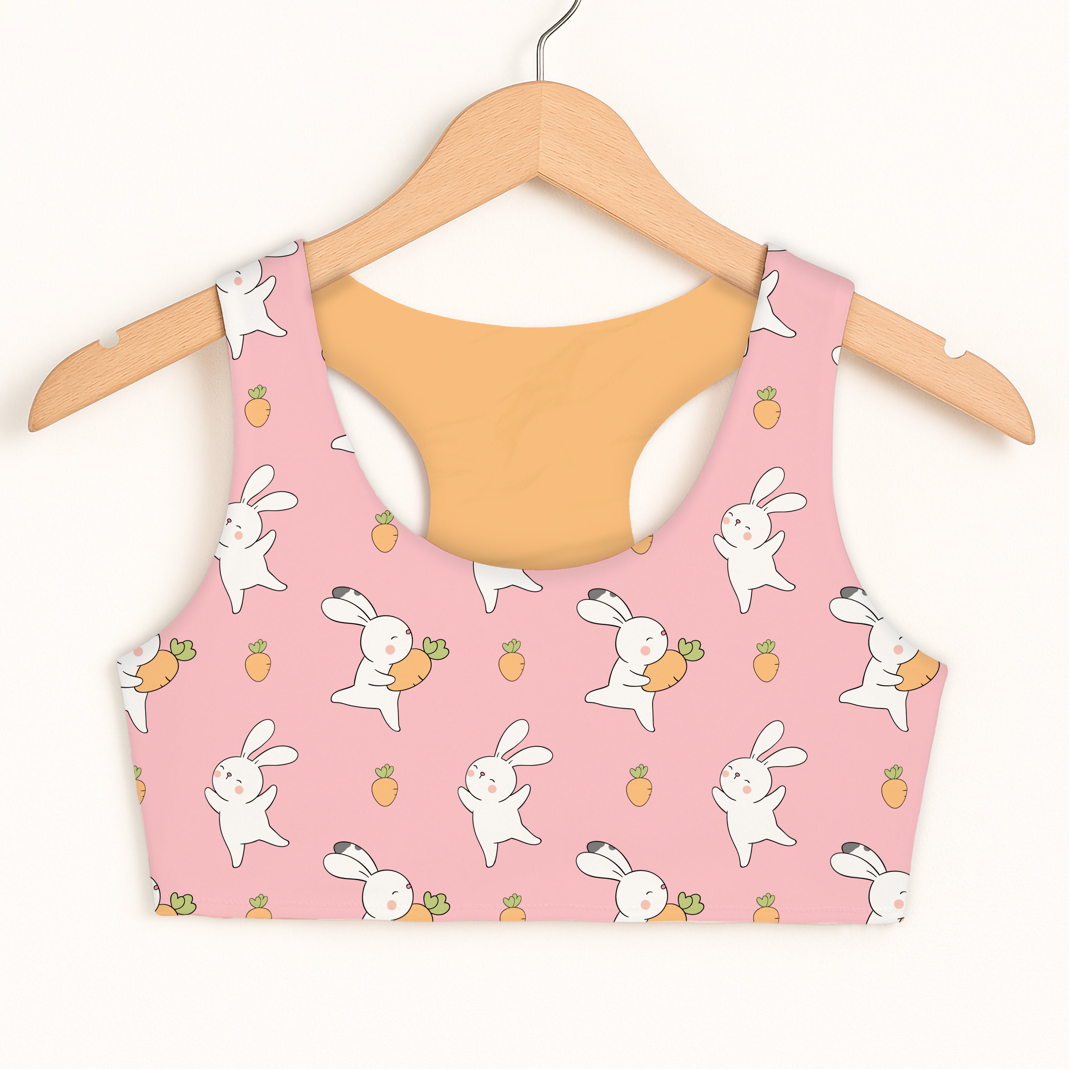 Girls pink bunny and carrot sports bra with quick drying double layered comfort and playful bunny pattern