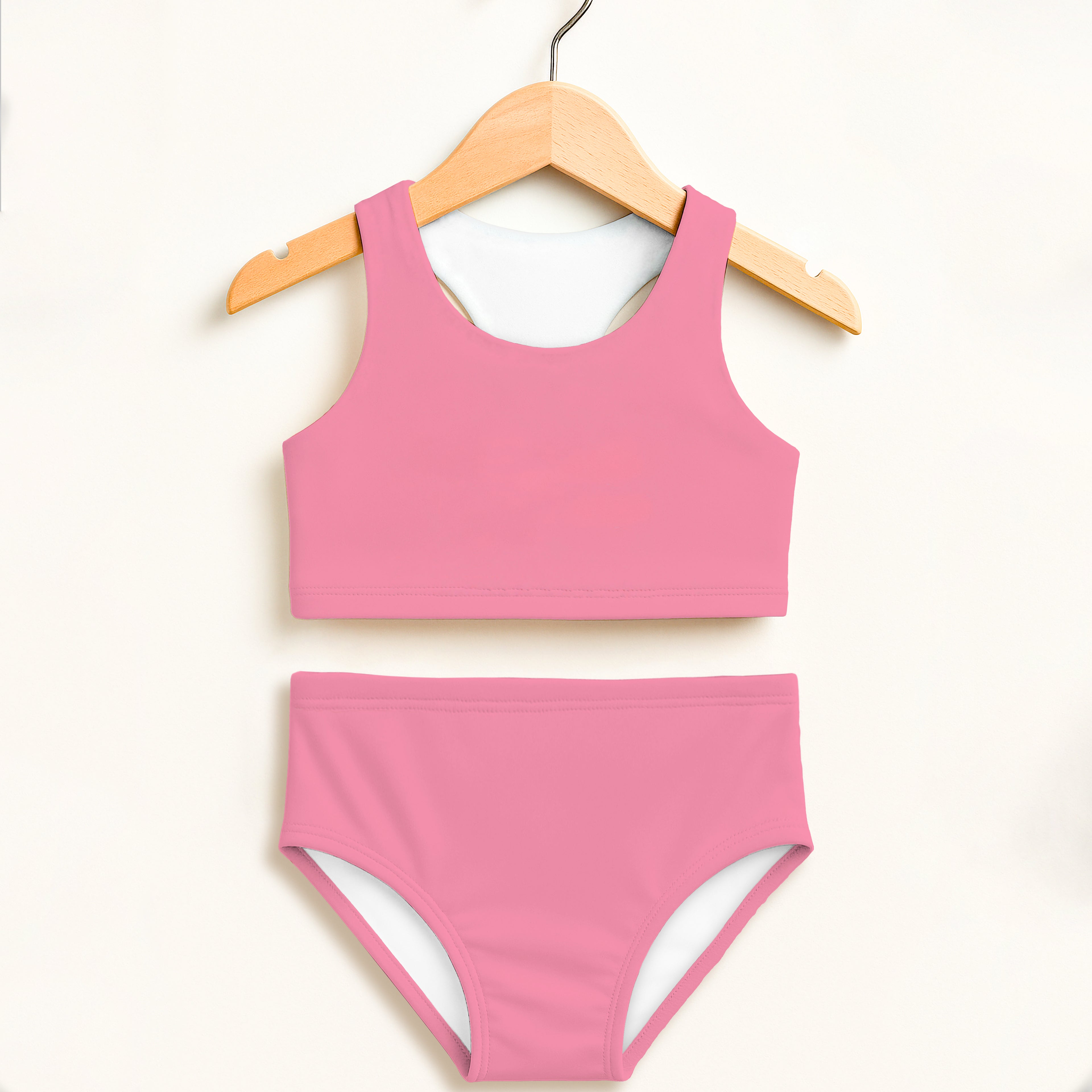 Girls pink two piece swimsuit with white lining featuring double layered upf 50 plus high waisted comfort