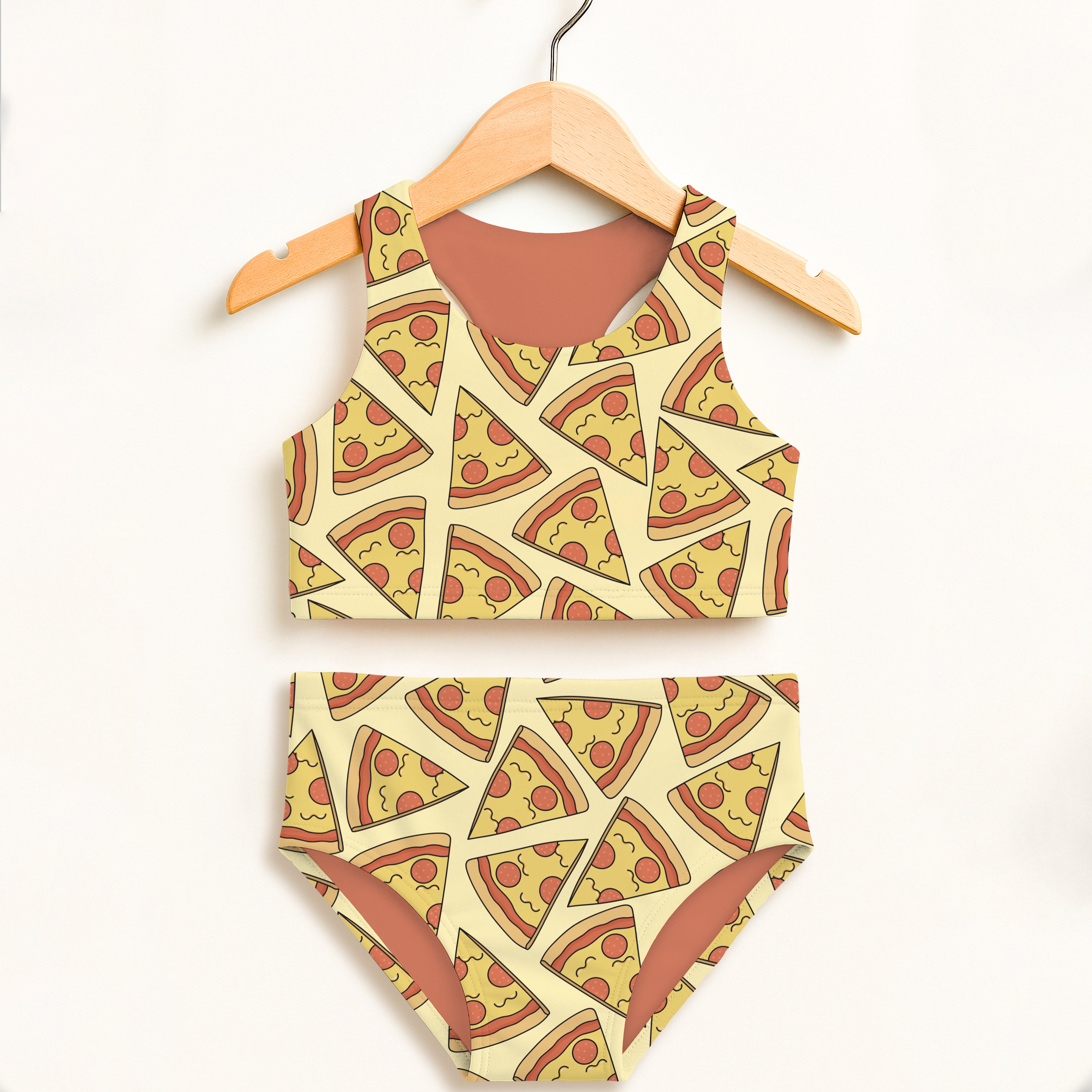 Yellow girls pizza slice two piece swimsuit with cartoon pepperoni print on wooden hanger with upf 50 plus protection