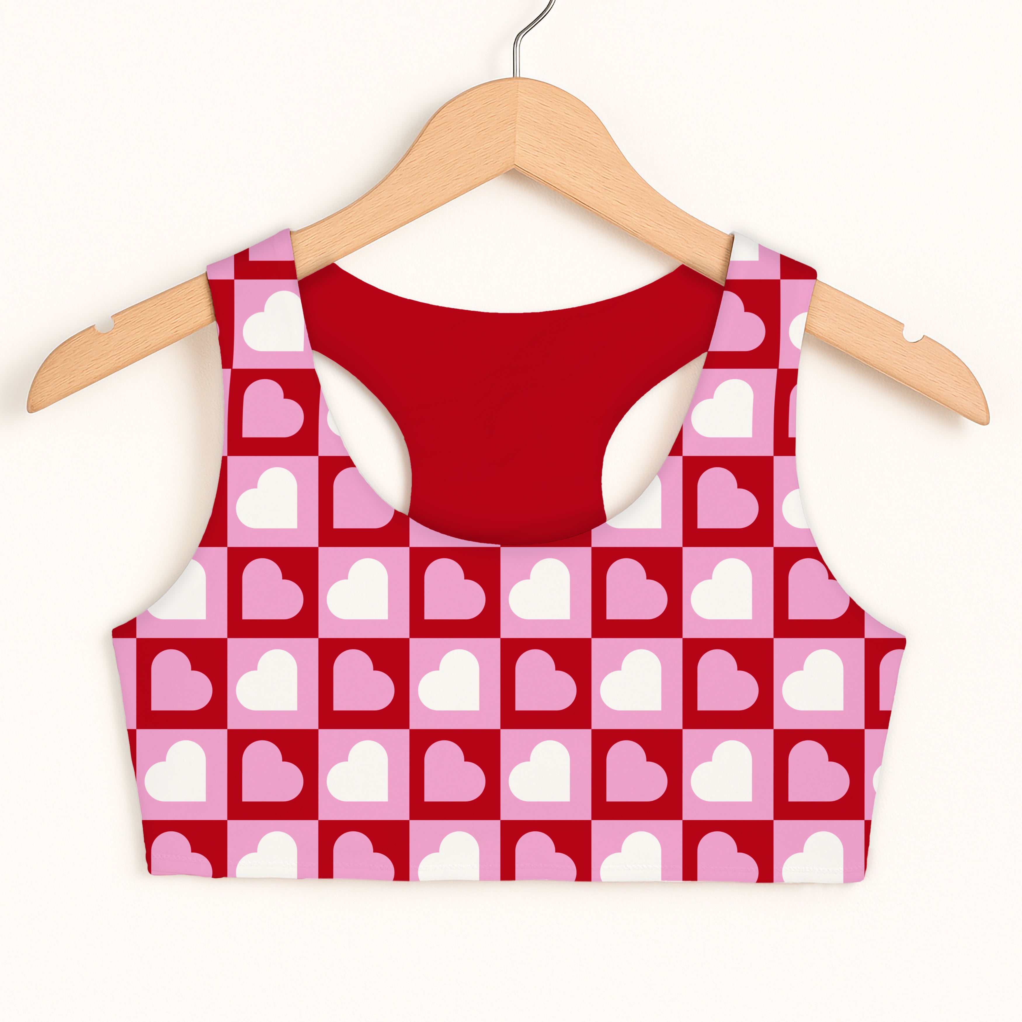 Girls checkered heart sports bra with pink and red heart pattern and solid red double layered quick drying lining