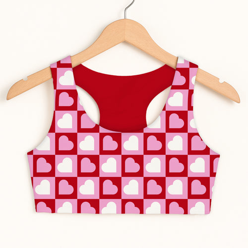 Girls checkered heart sports bra with pink and red heart pattern and solid red double layered quick drying lining
