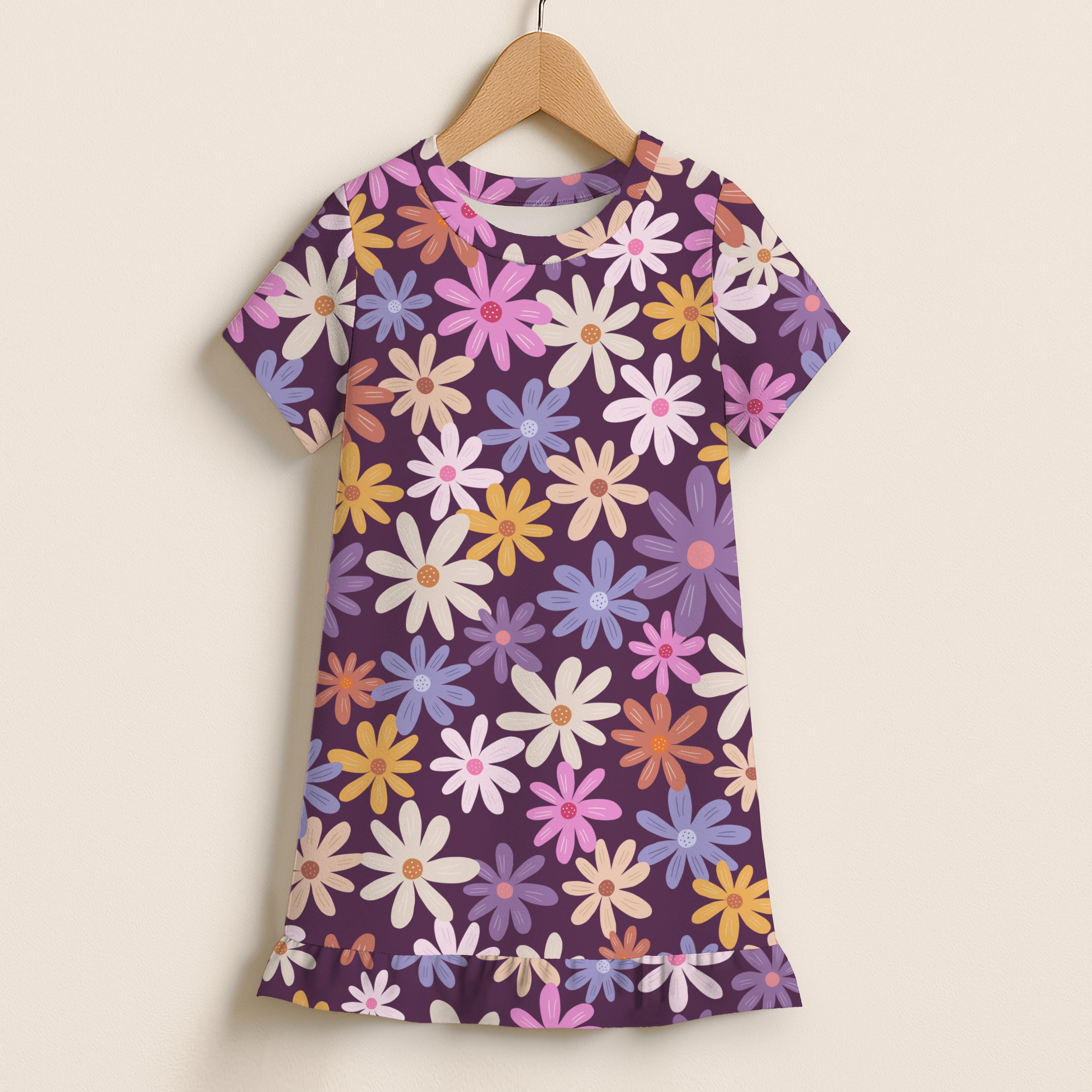 Girls purple floral short sleeve dress with colorful daisy print and ruffled hem perfect for casual wear