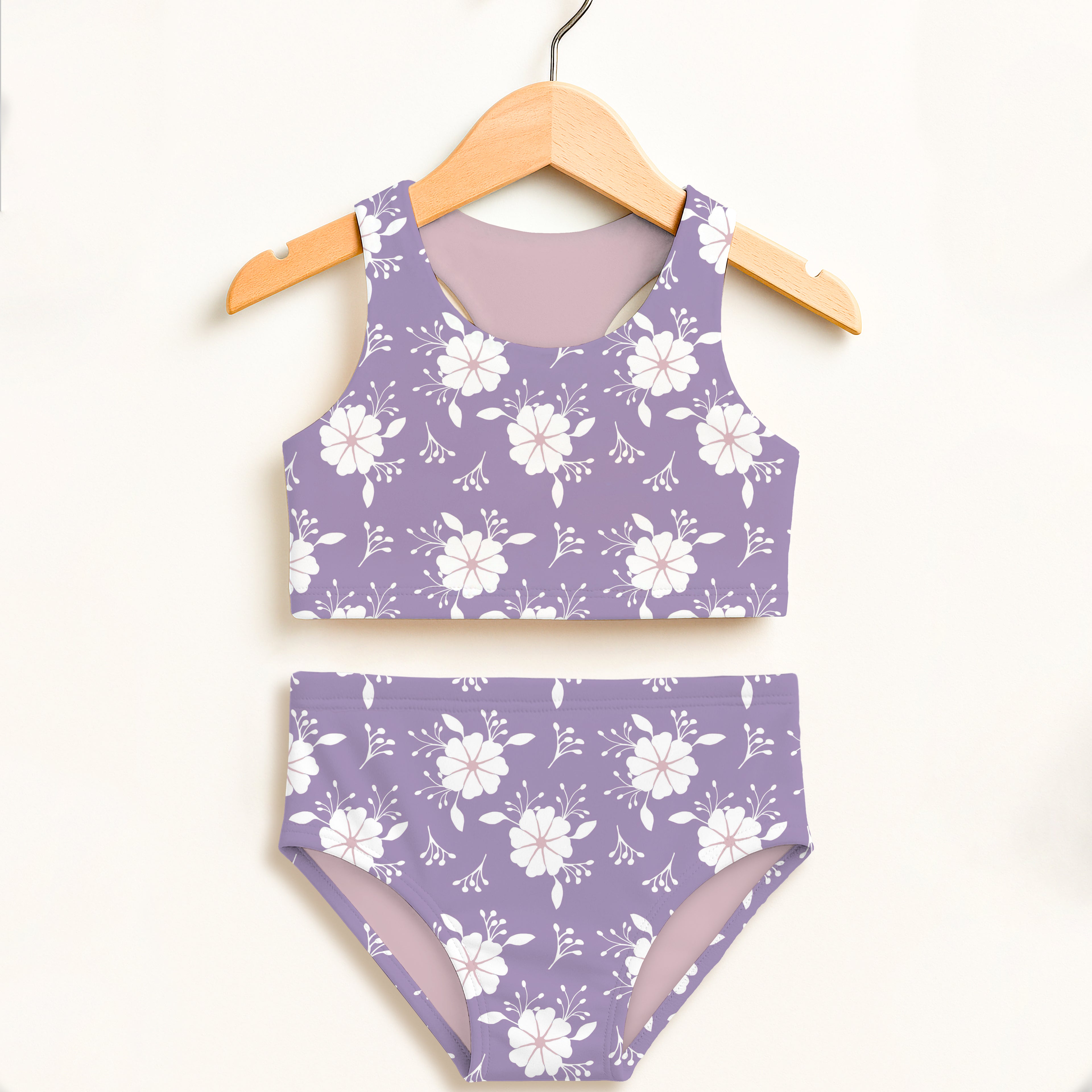 Girls lavender floral two-piece swimsuit with white flower and vine pattern and double layered upf 50 plus fabric