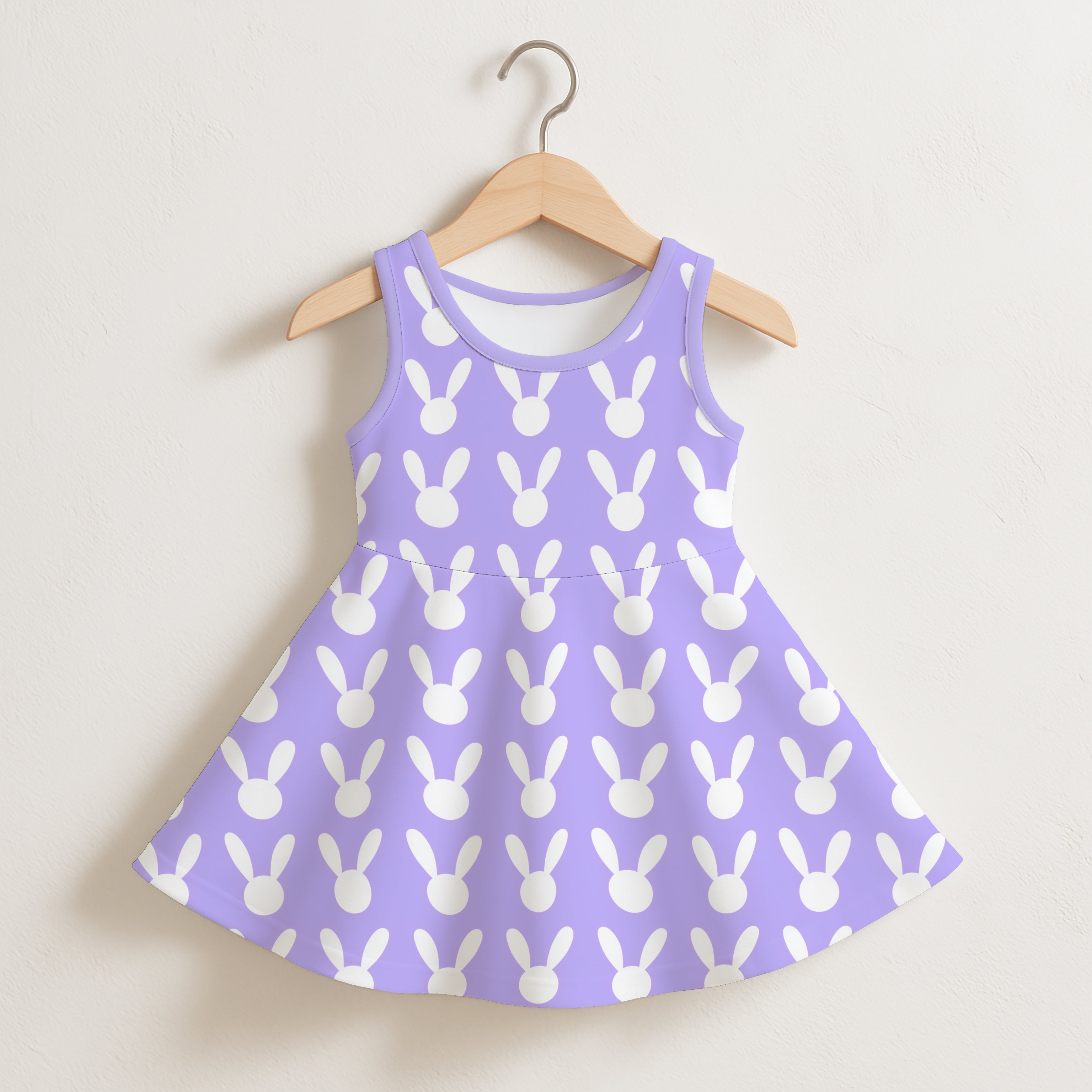 Girls purple bunny silhouette sleeveless dress with lavender fabric and white bunny head pattern on wooden hanger