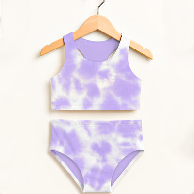 Girls purple and white tie dye two piece swimsuit hanging on wooden hanger with double layered UPF 50 plus fabric