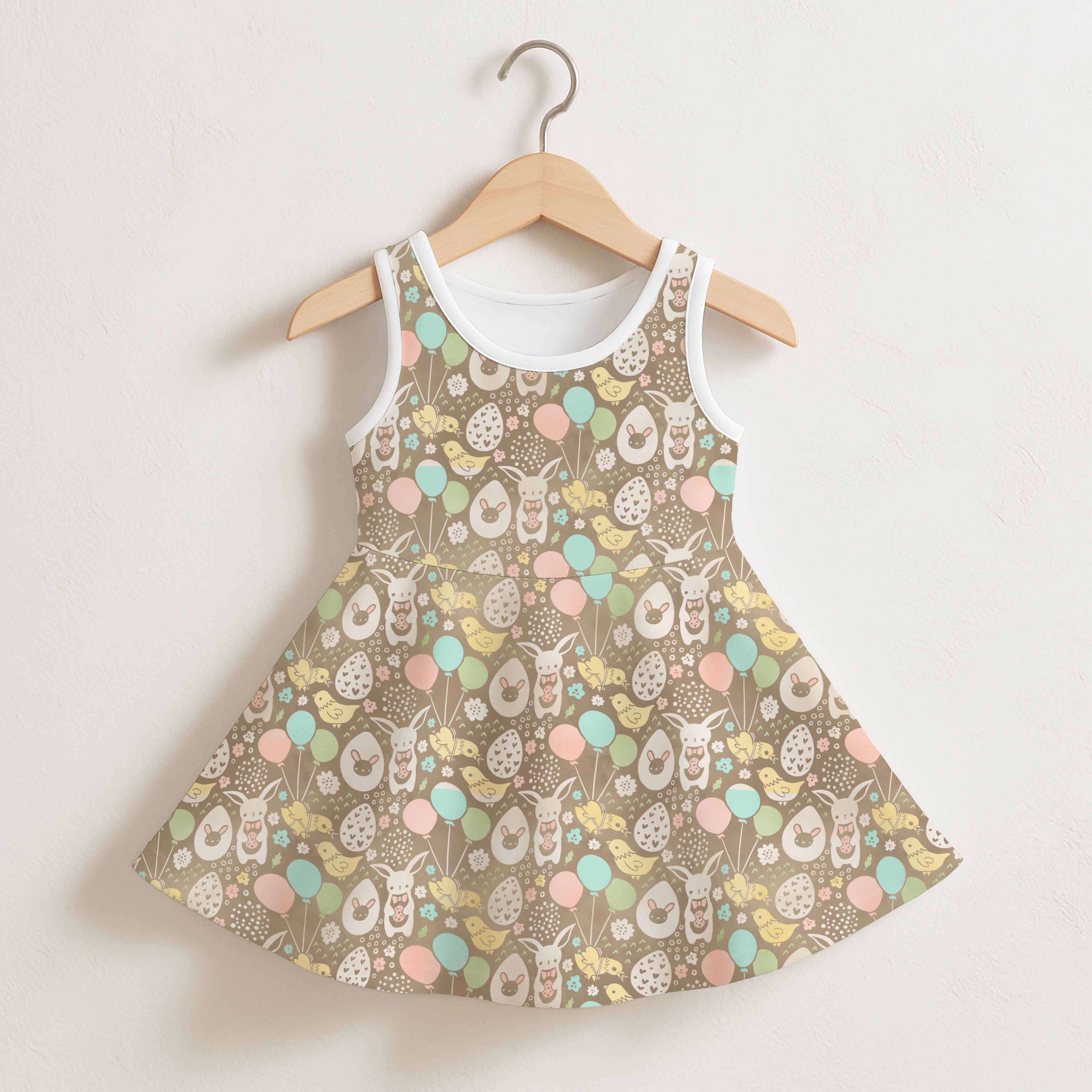 Girls easter themed sleeveless dress with charming brown fabric and playful bunnies chicks and pastel balloons pattern