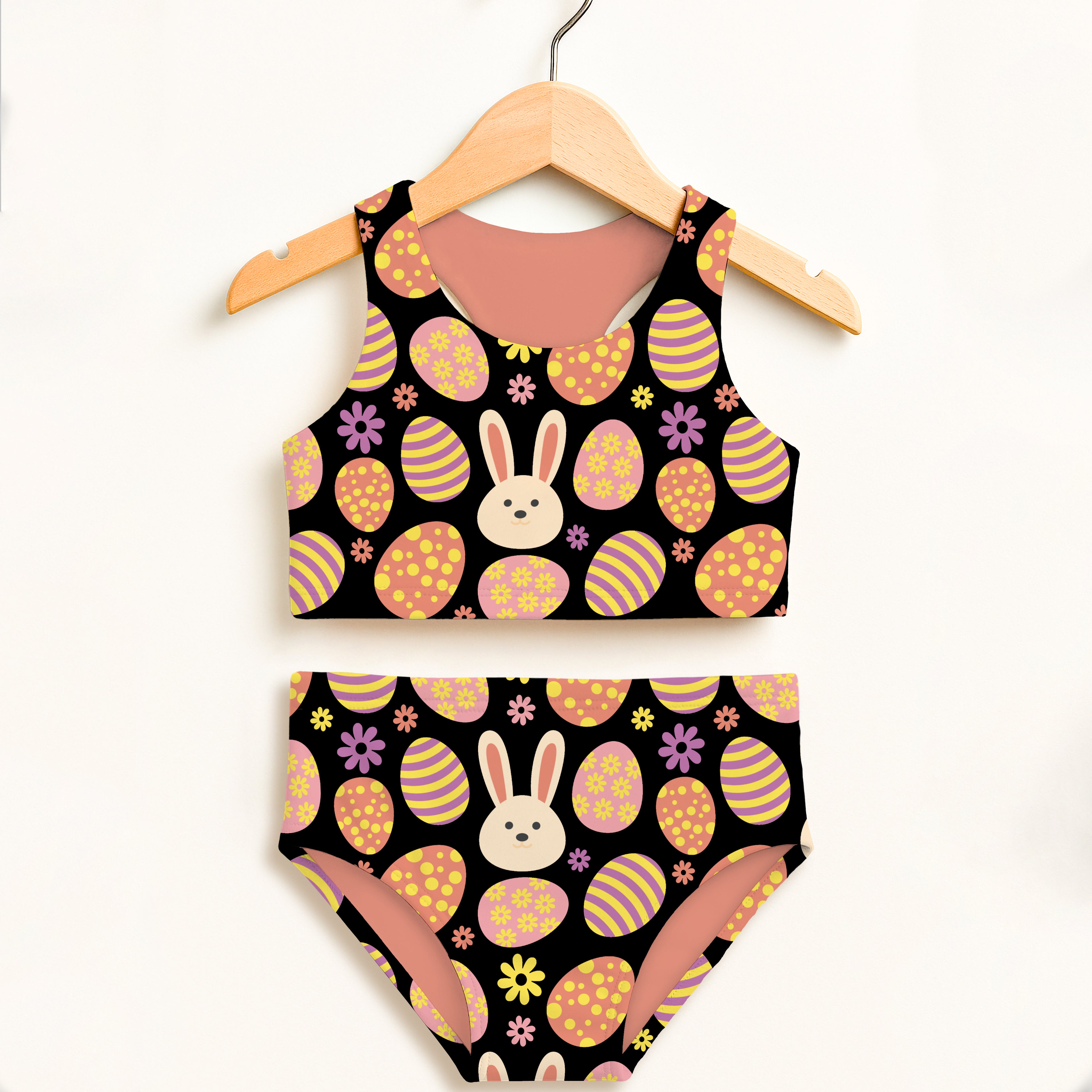 Girls black easter bunny two piece swimsuit with pastel eggs purple flowers and white bunny faces upf 50+ high waisted