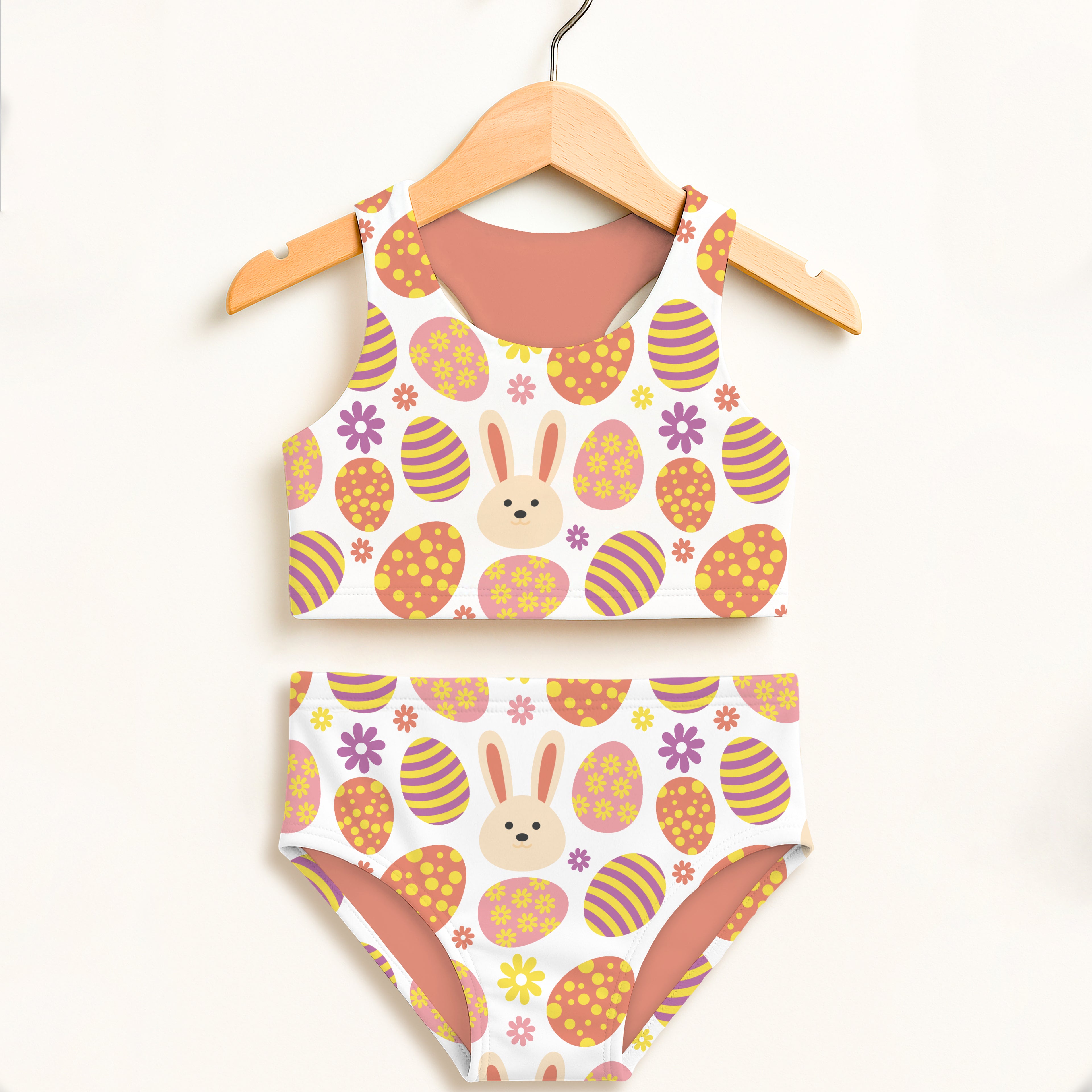 Girls white easter bunny two piece swimsuit with orange yellow striped eggs purple flowers and bunny faces design