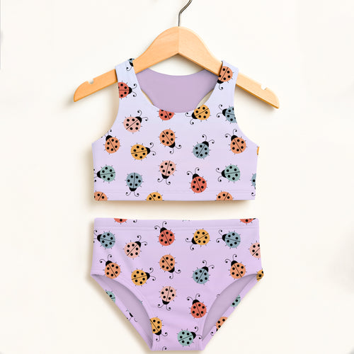 Pastel lavender girls colorful ladybug two piece swimsuit with playful pattern and upf 50 plus high waisted comfort