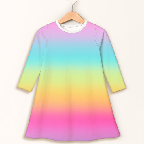 Girls bright rainbow long sleeve dress featuring a vibrant gradient and white ribbed crew neck for everyday wear