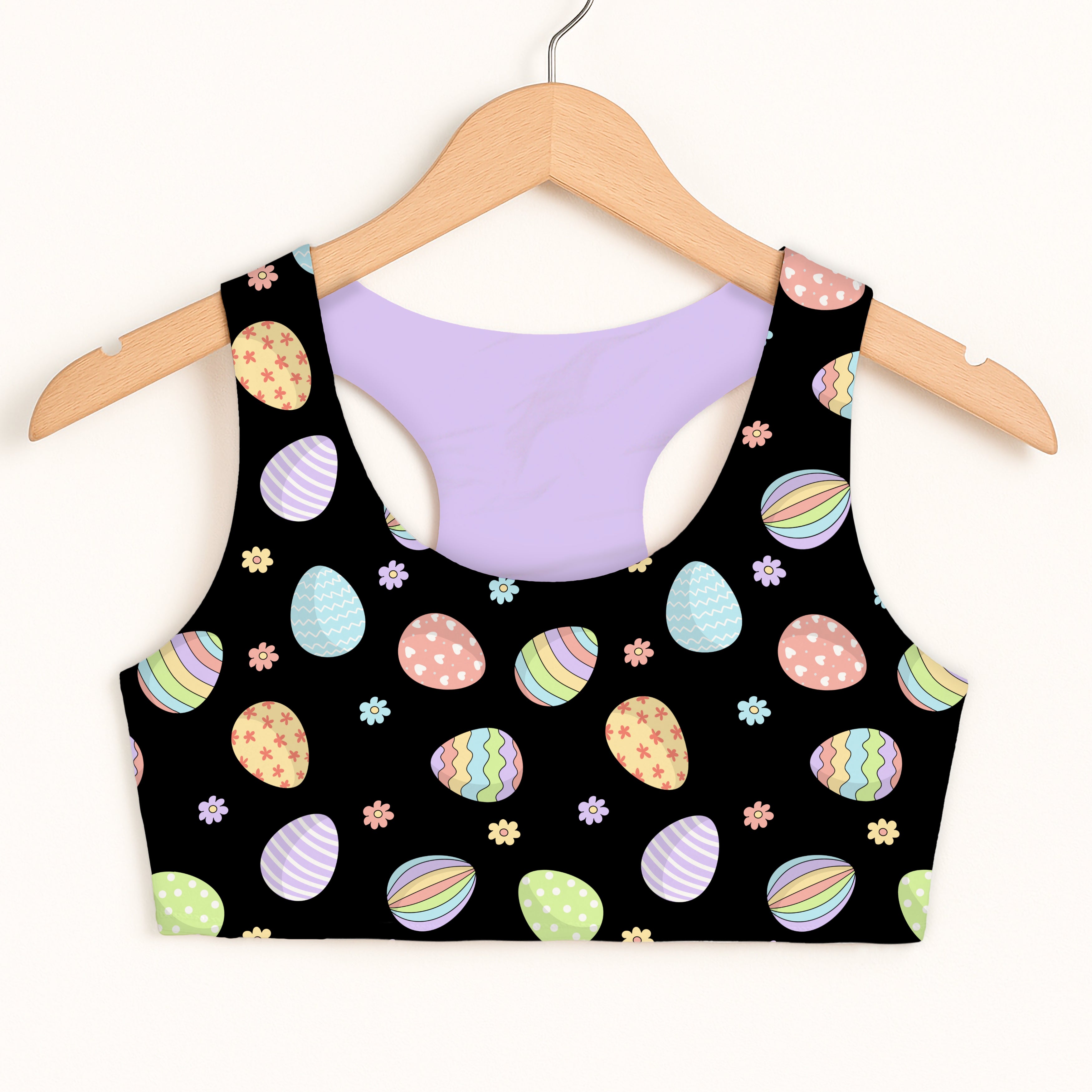 Girls black rainbow easter egg sports bra with pastel pattern and lavender lining quick drying double layered comfort