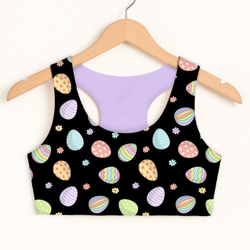 Girls black rainbow easter egg sports bra with pastel pattern and lavender lining quick drying double layered comfort
