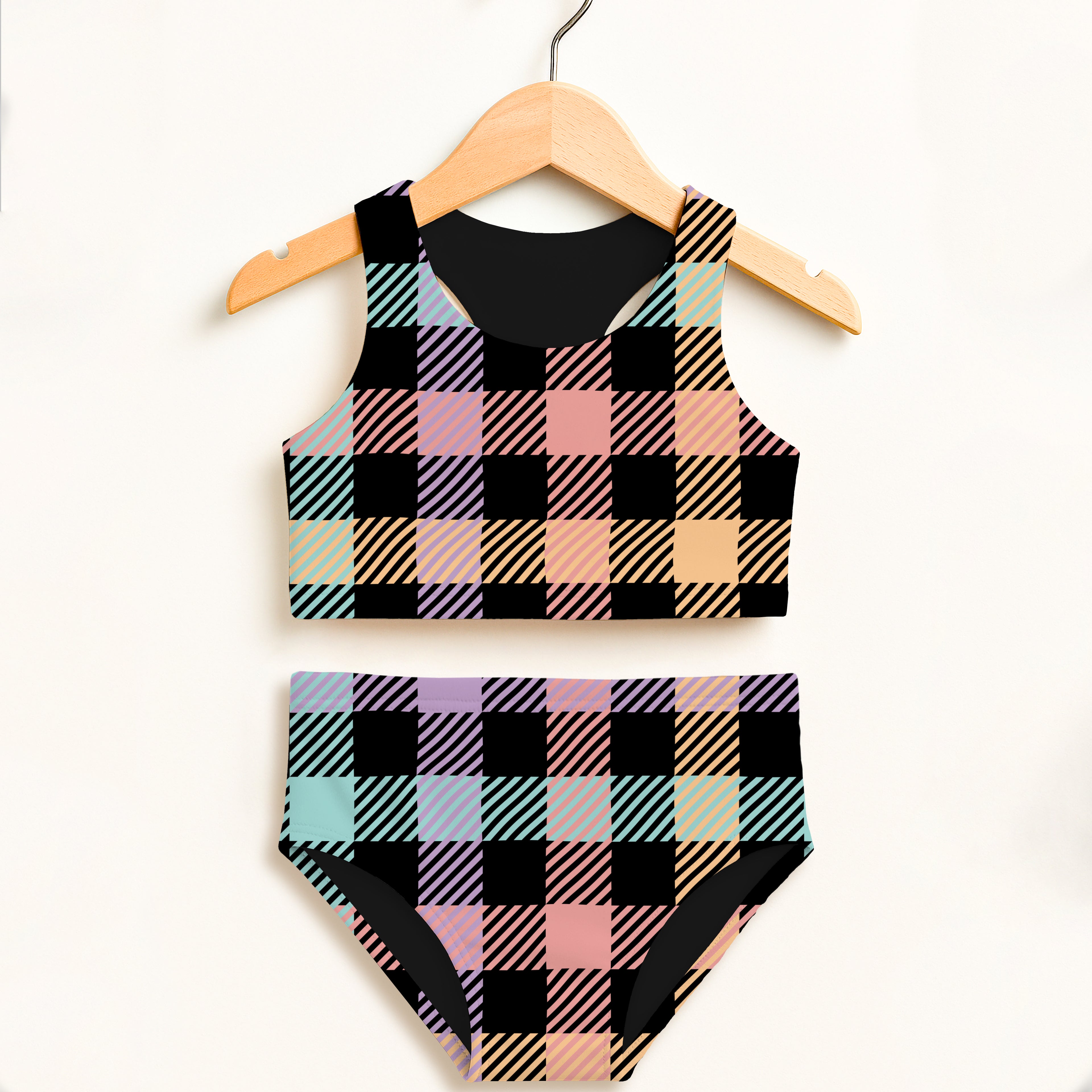 Girls pastel rainbow gingham two piece swimsuit with pastel plaid black pink and mint diagonal stripes and upf 50+ protection