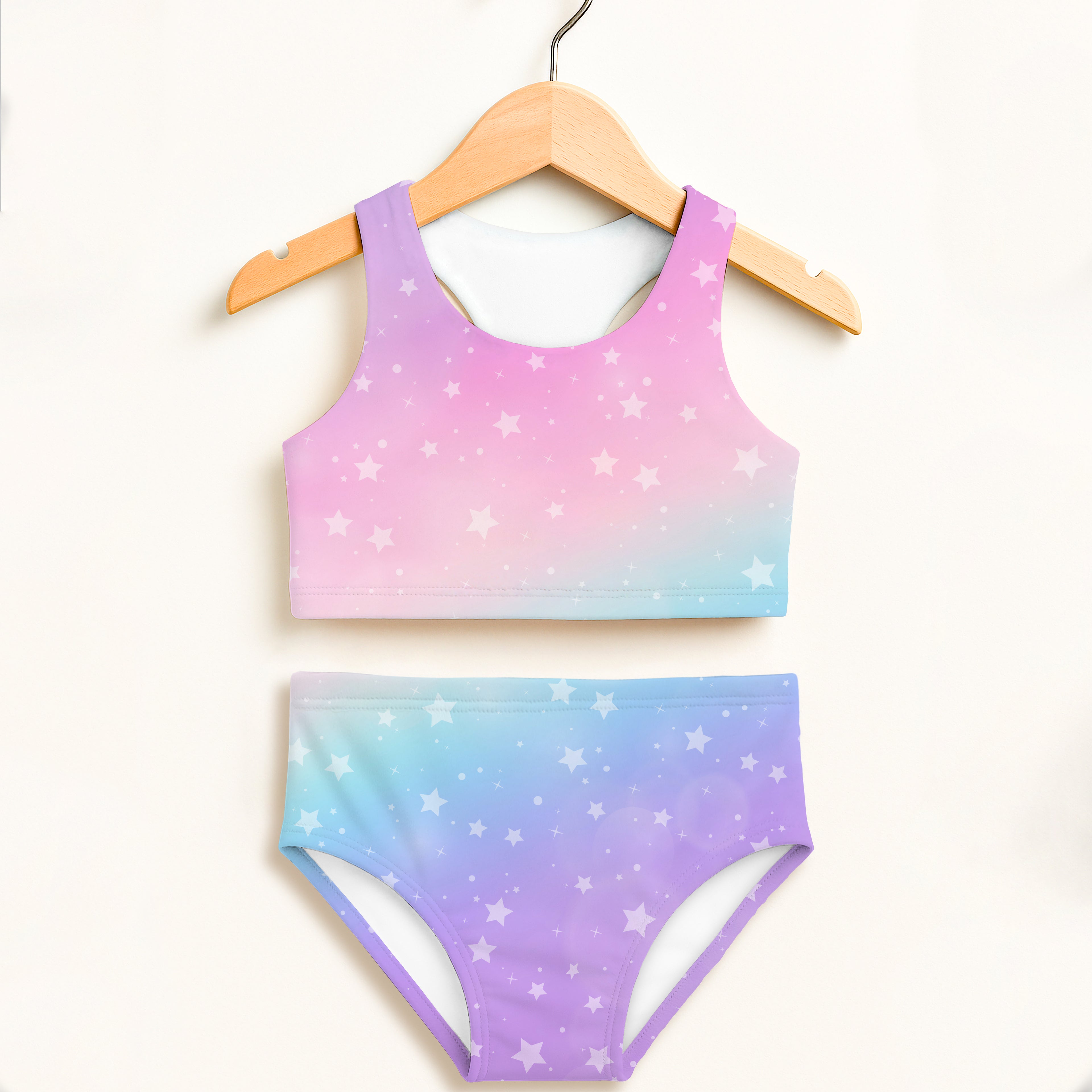 Girls rainbow stars two piece swimsuit with pastel gradient star print double layered fabric and UPF 50 plus protection