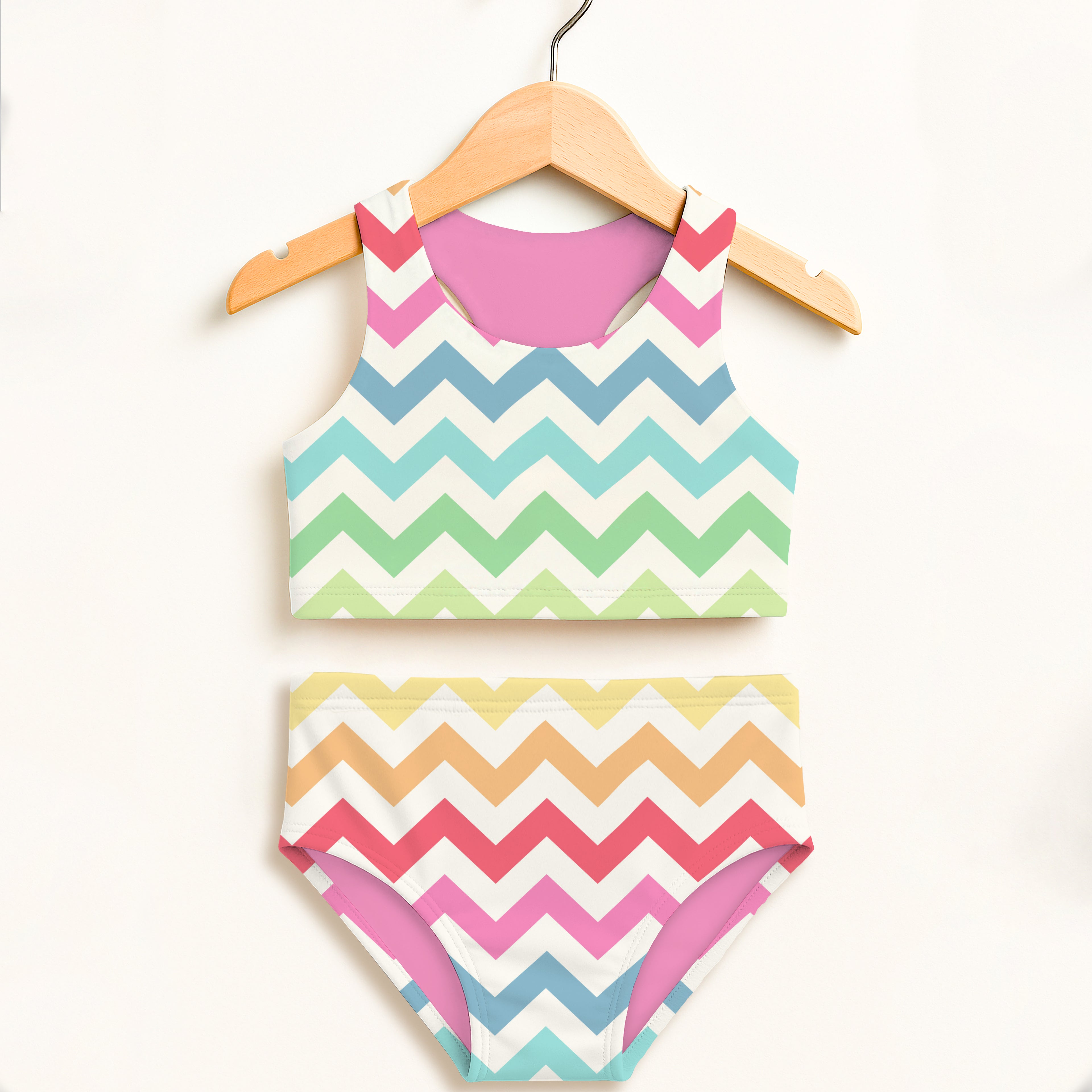 Girls rainbow chevron waves two piece swimsuit with pastel chevron pattern pink lining and upf 50+ protection