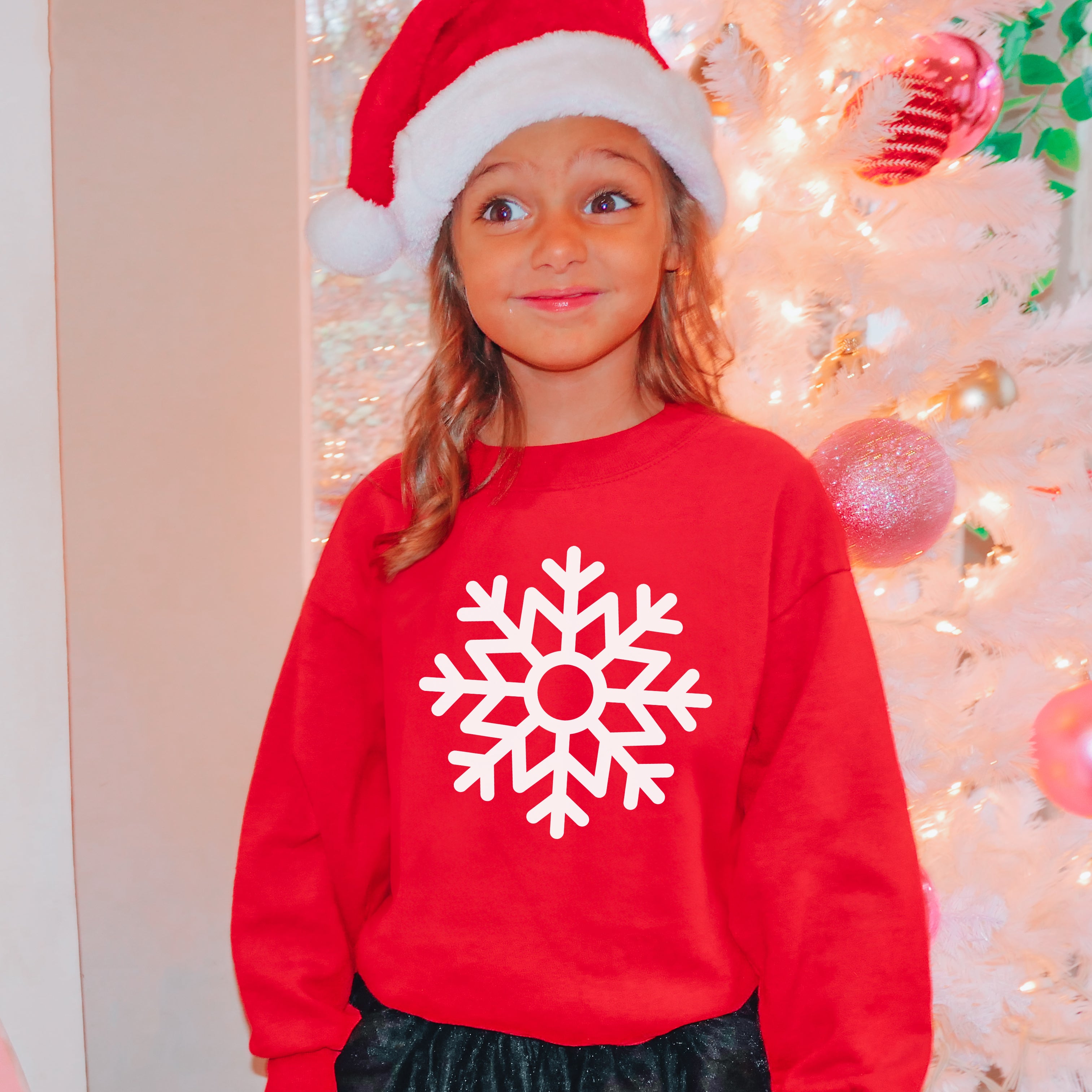 Kids red christmas sweatshirt with white snowflake design made of soft material for festive holiday wear