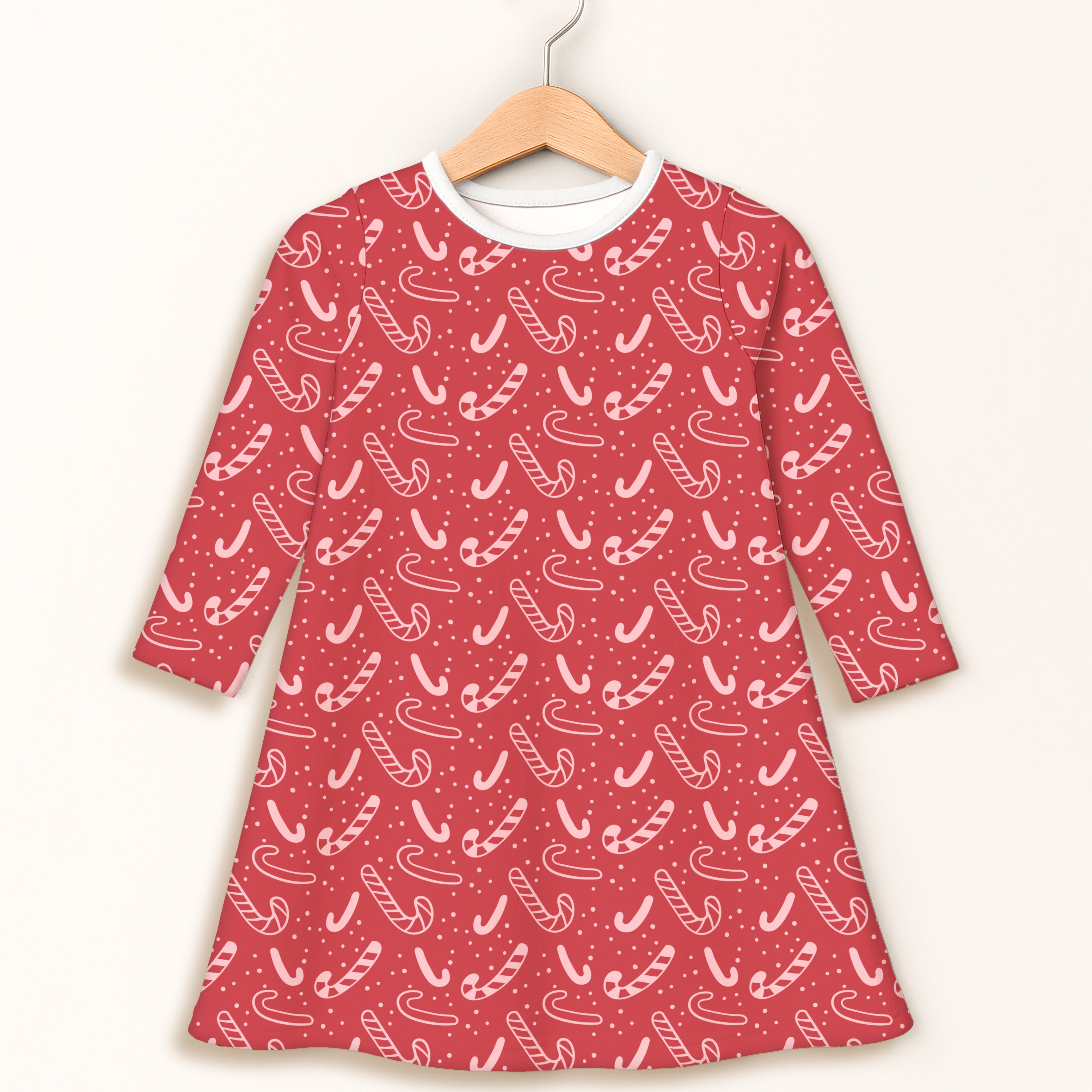 Girls red candy cane long sleeve dress with white trim featuring festive striped pattern for holiday wear