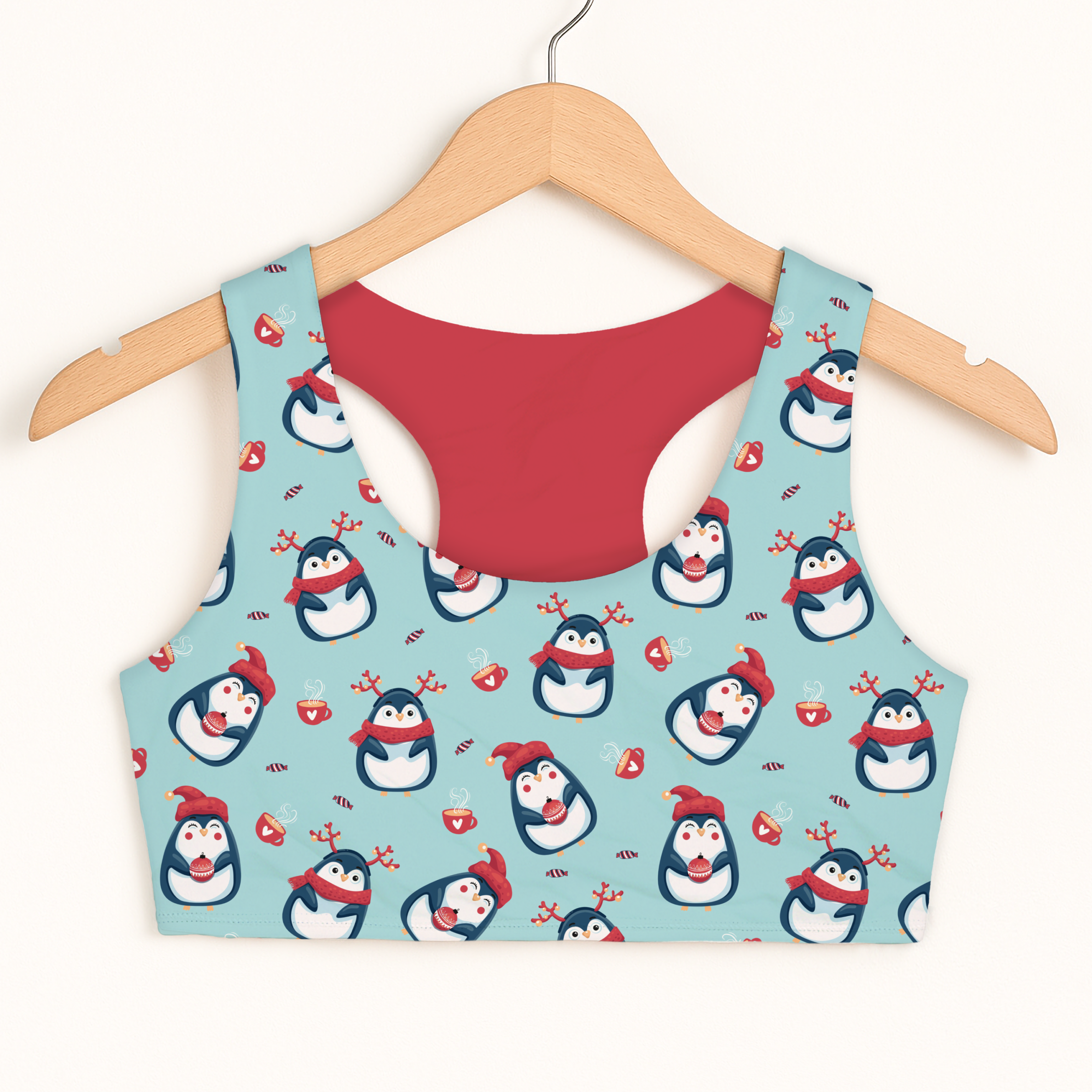 A festive light blue girls reindeer penguin christmas sports bra with quick drying fabric and double layered comfort