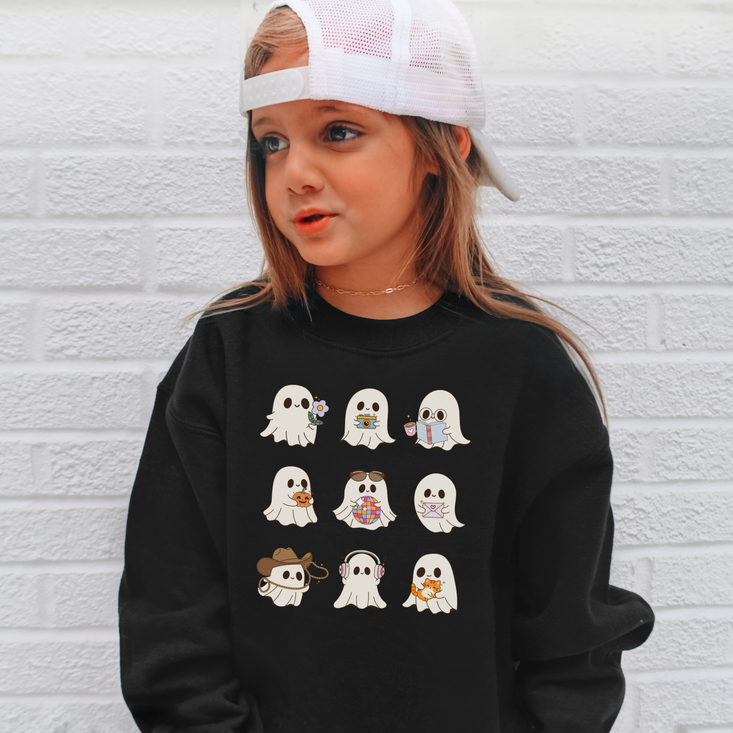 Black long-sleeved kids retro ghost sweatshirt with a playful white cartoon ghost grid pullover for toddlers and youth