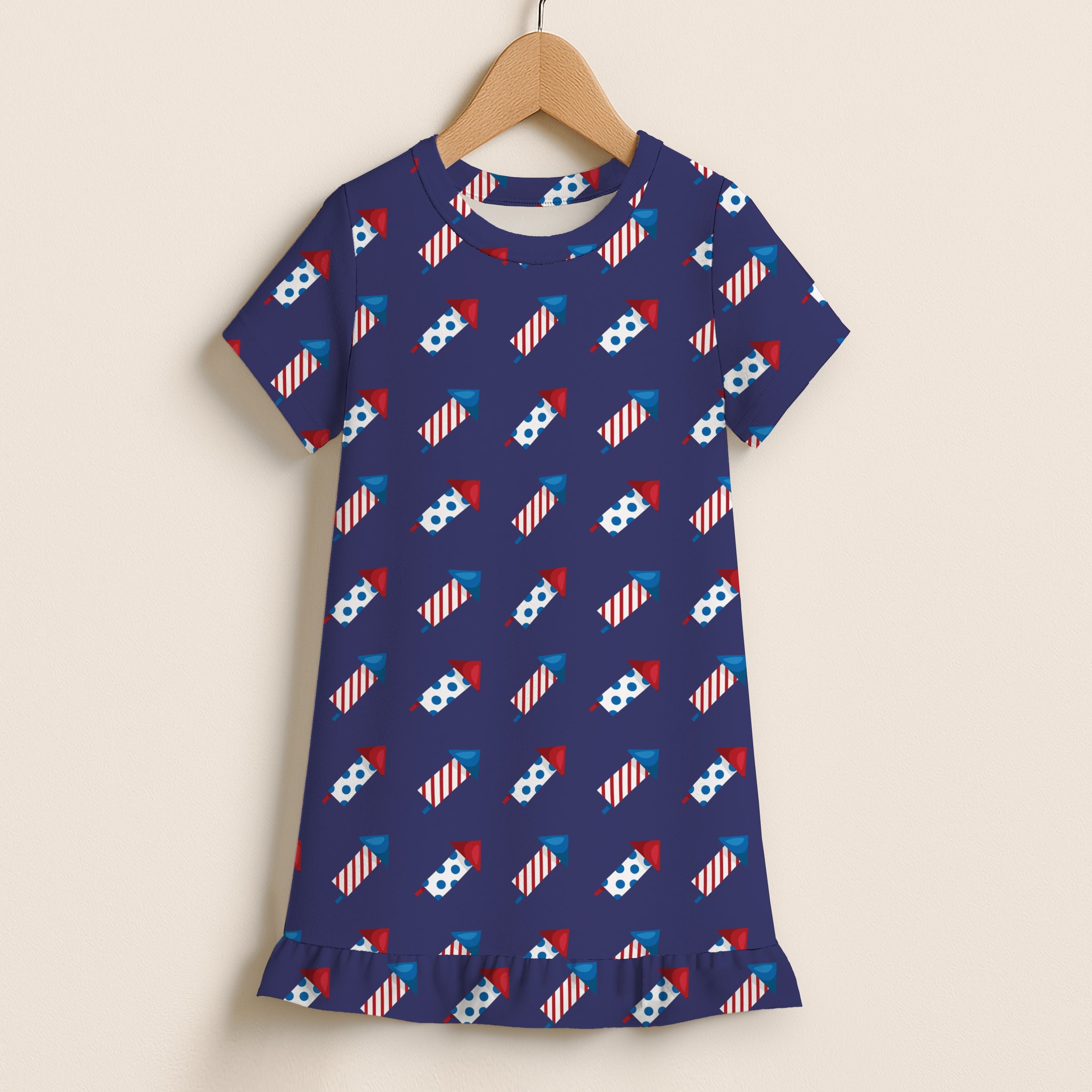 Girls navy blue short sleeve dress with red white and blue fireworks pattern and ruffle hem for 4th of July celebration