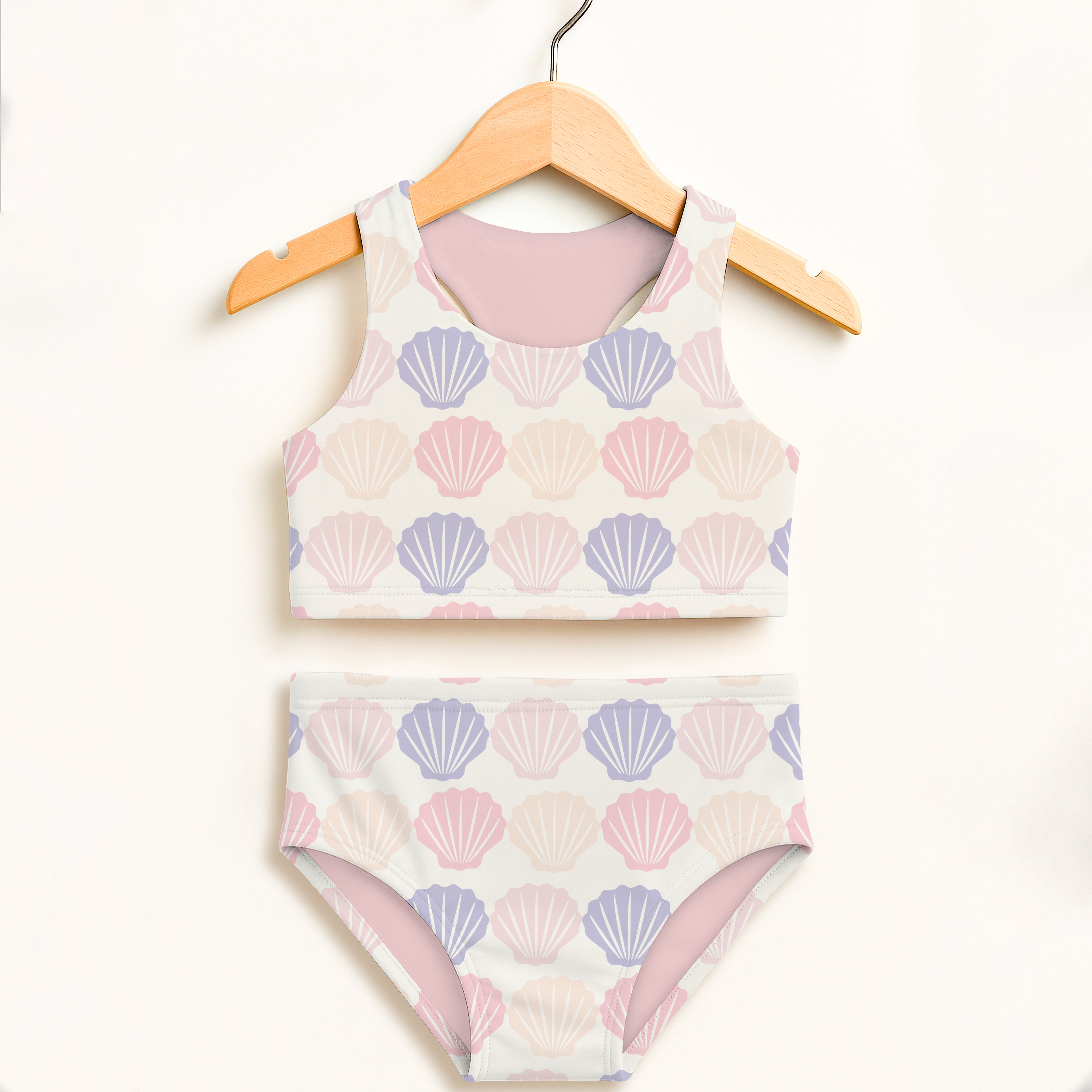 Girls pastel seashell two piece swimsuit with soft pink and lavender shells on white double layered high waisted comfort