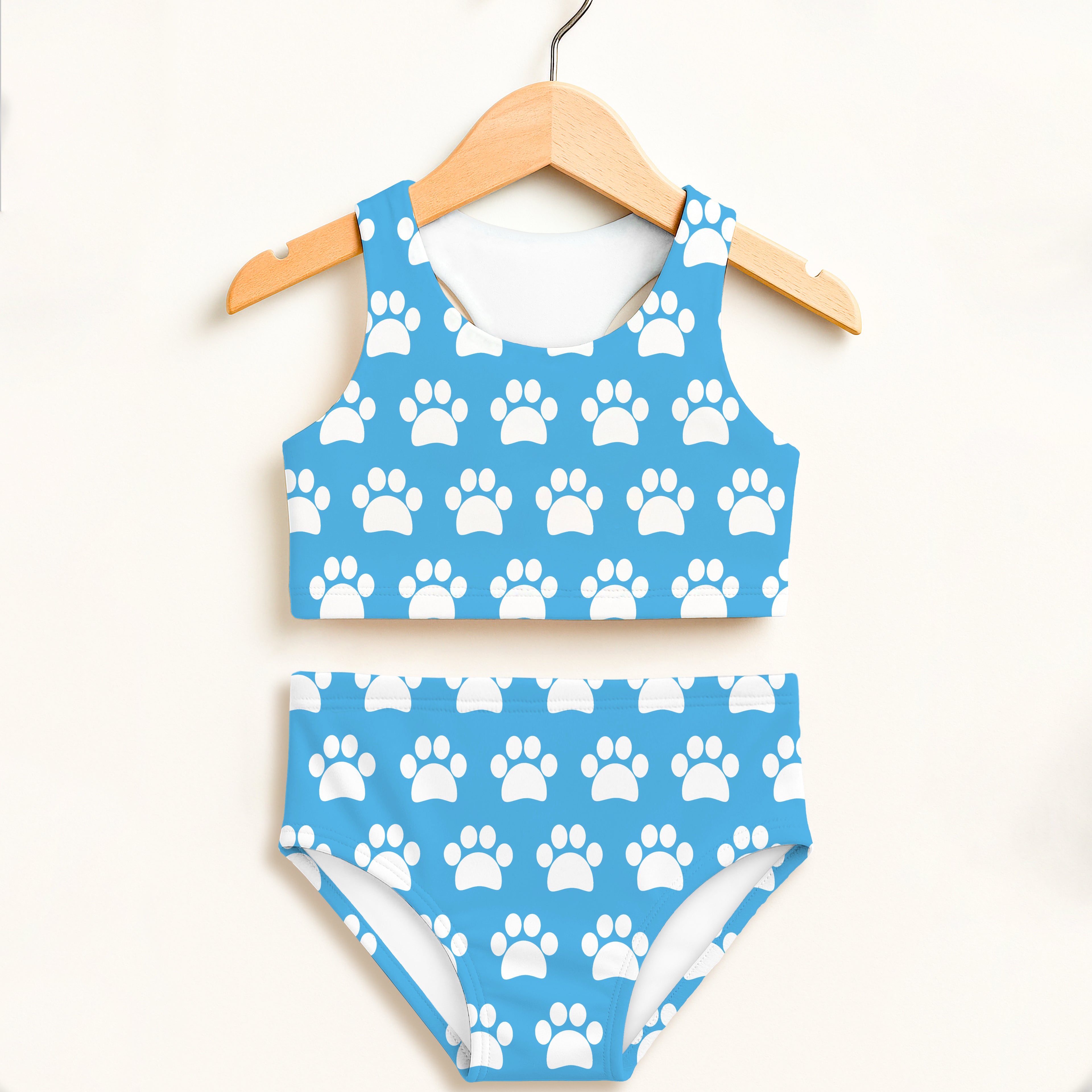 Girls sky blue paw print two piece swimsuit with halter top high waisted bottoms and double layered UPF 50+ comfort