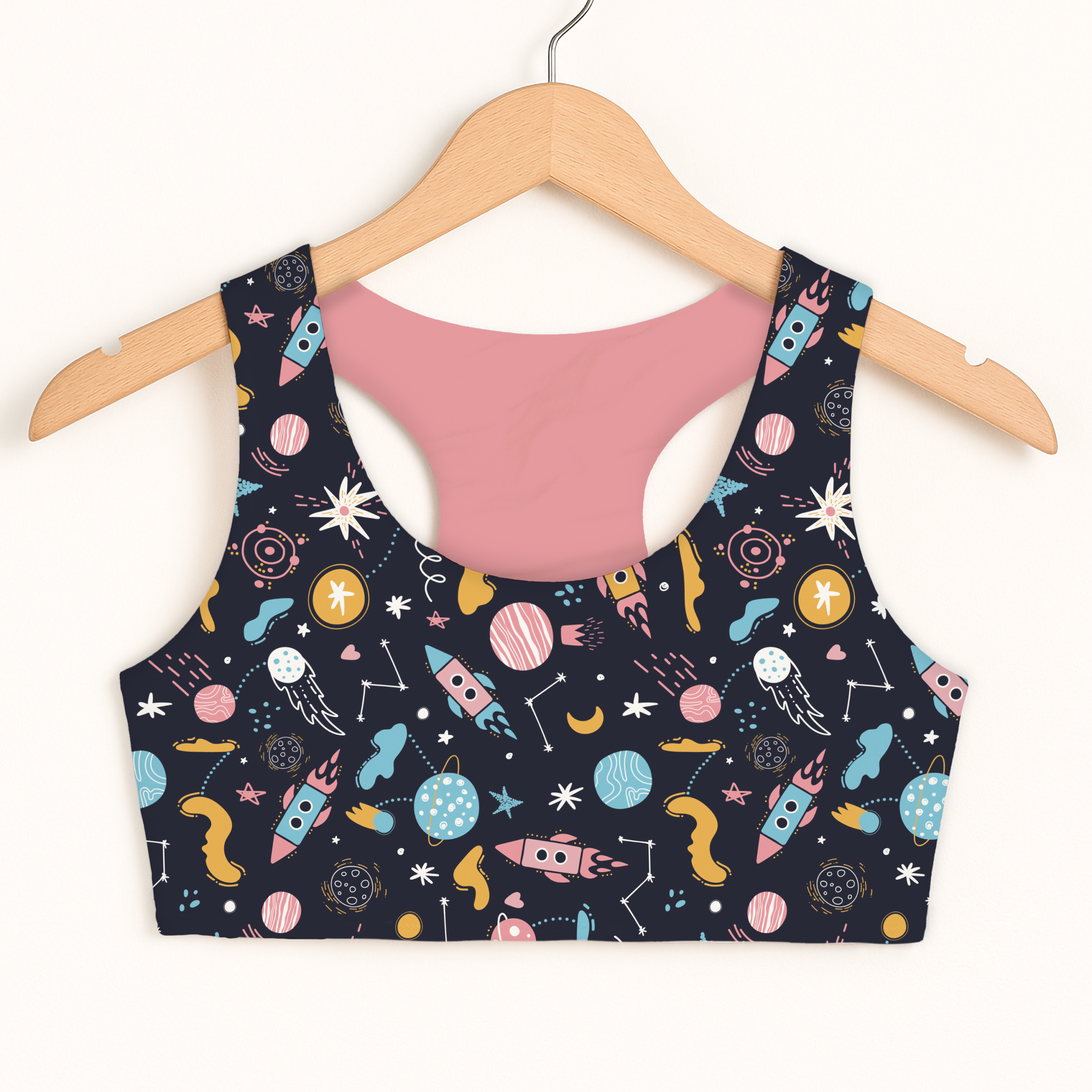 Girls outer space sports bra navy blue quick drying double layered with colorful pastel rockets planets and stars design