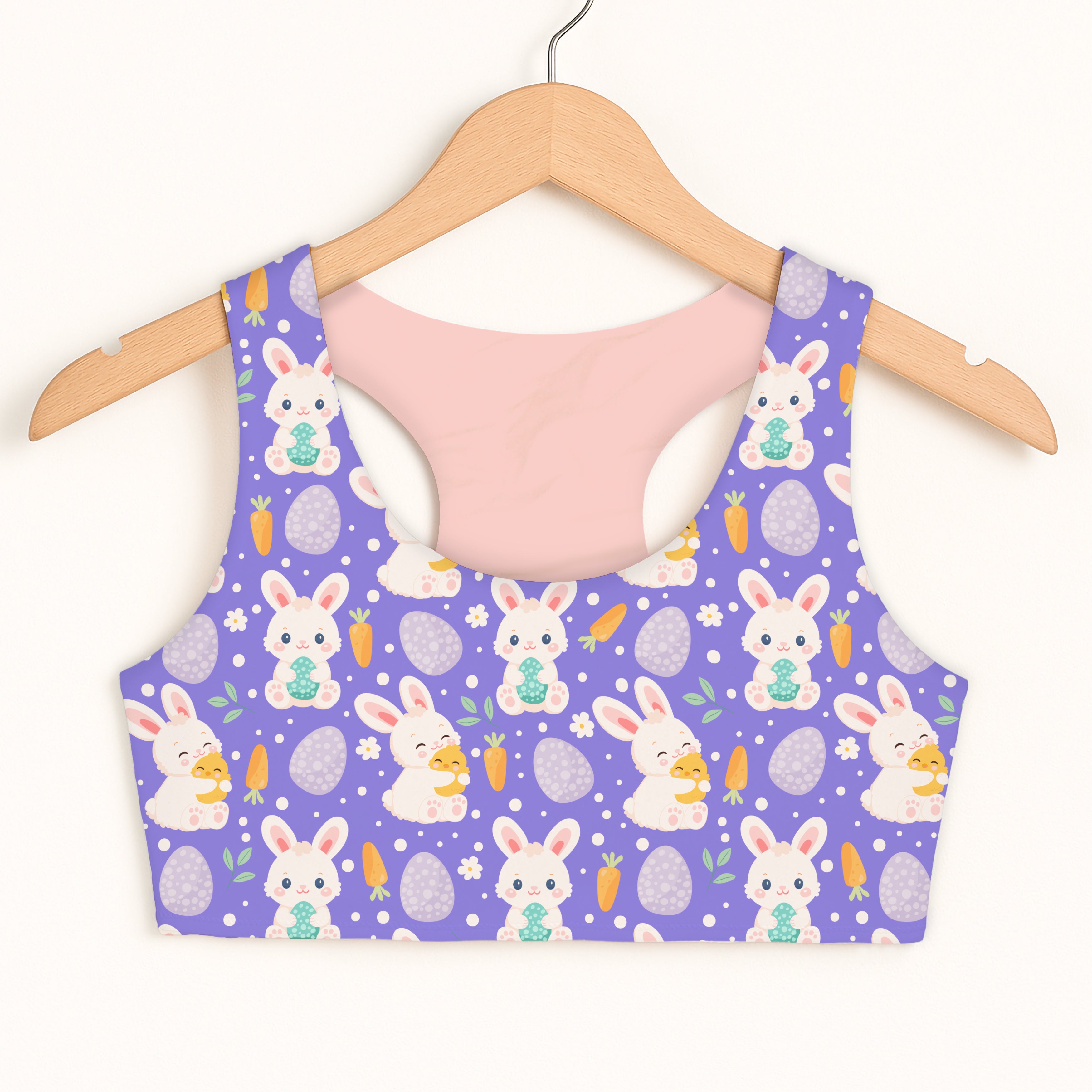 Girls purple bunny and egg patterned quick drying sports bra with pink interior lining and double layered comfort