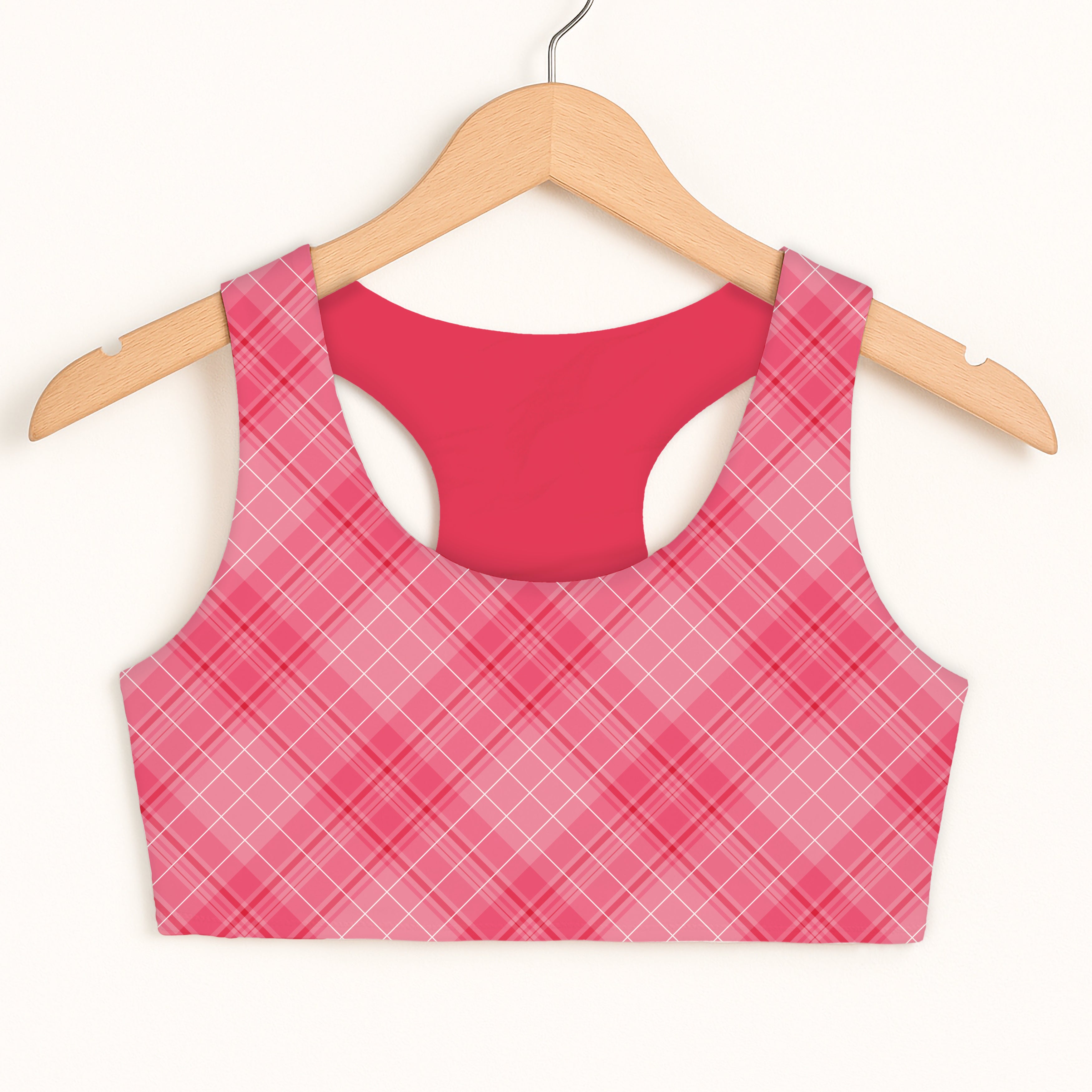 Girls pink plaid sports bra with quick drying fabric and double layered solid red interior lining for comfort