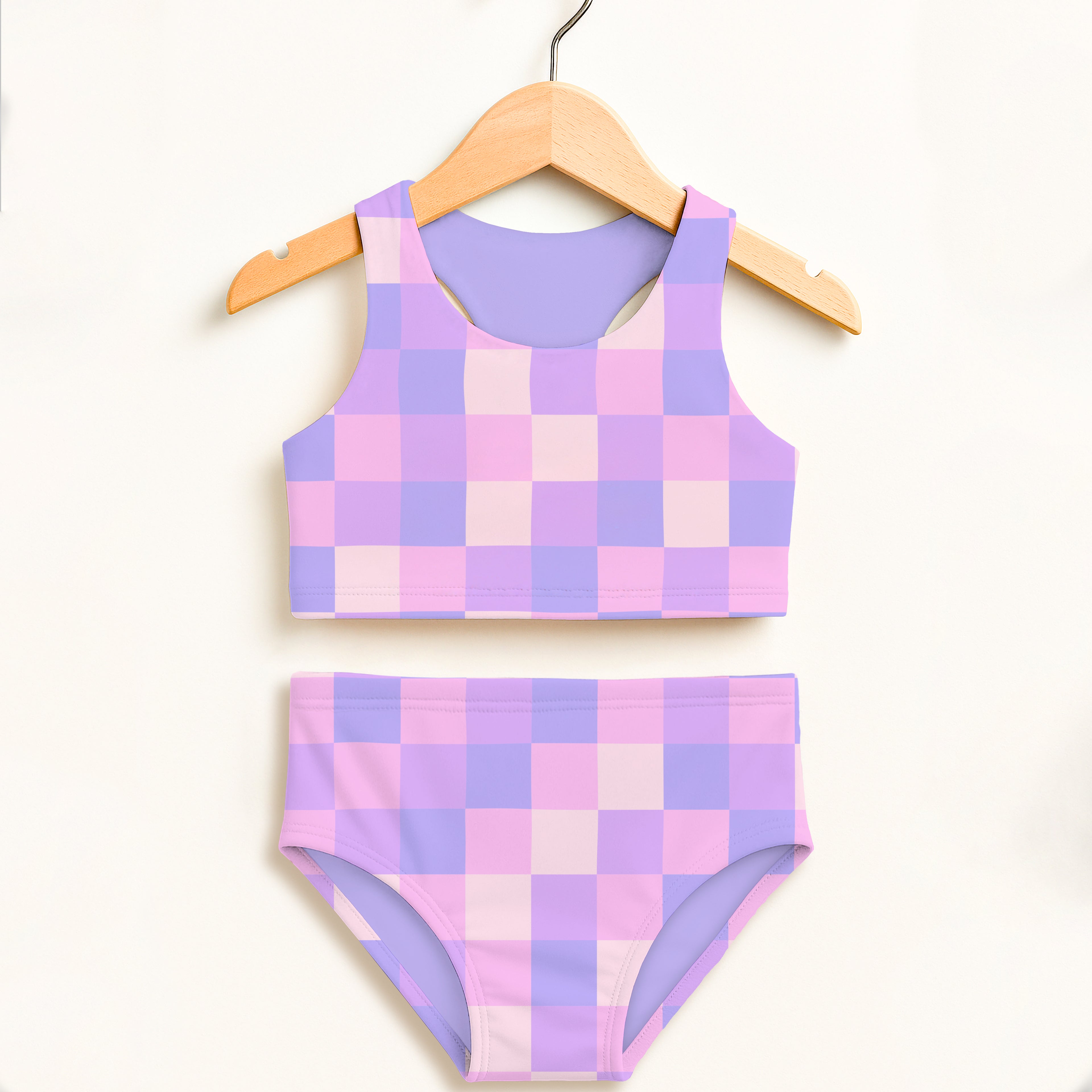 Girls purple squares two piece swimsuit set in pastel pink and lavender checkered pattern with upf 50 plus protection