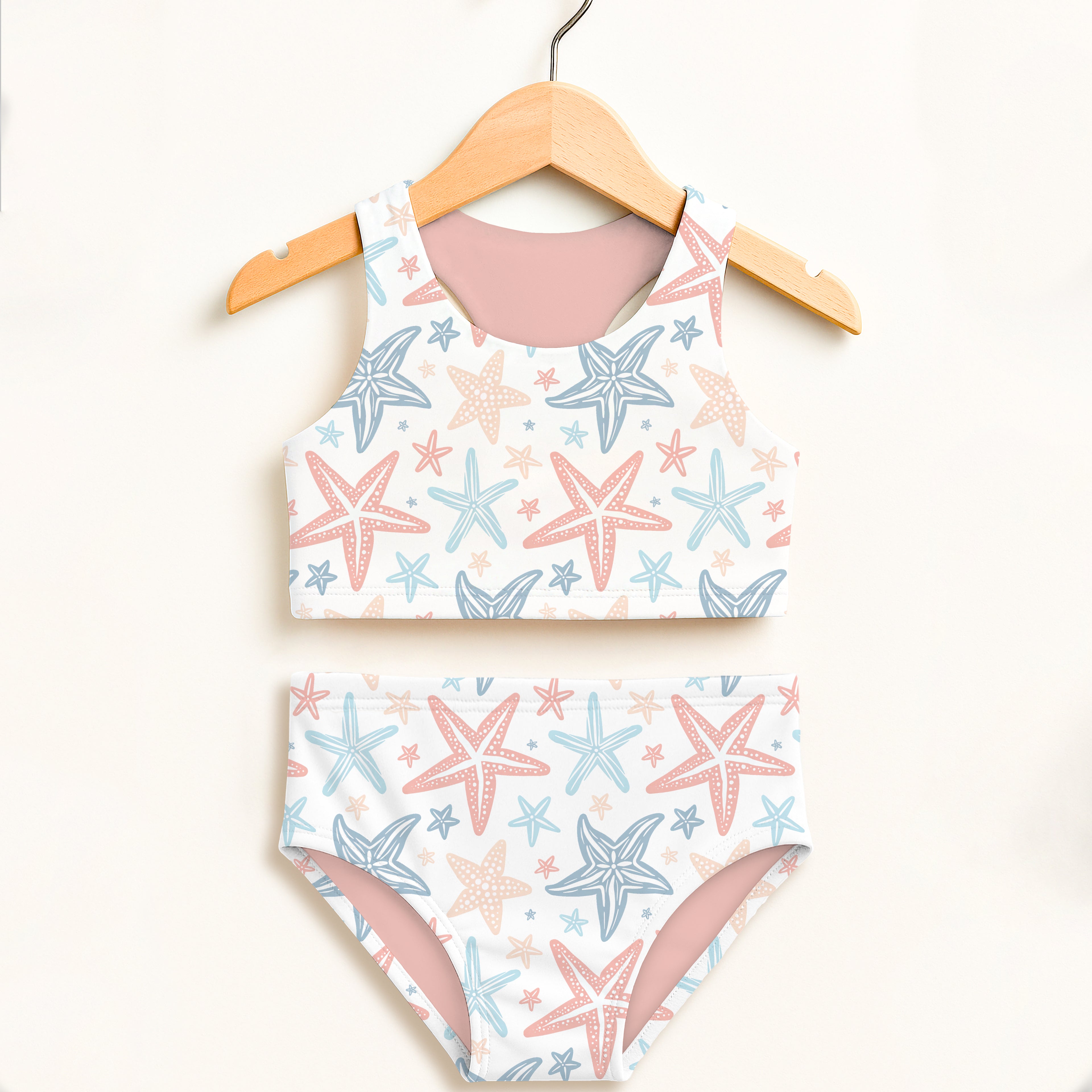 Girls pastel starfish two piece swimsuit with white starfish pattern pink blue accents halter top high waisted comfort