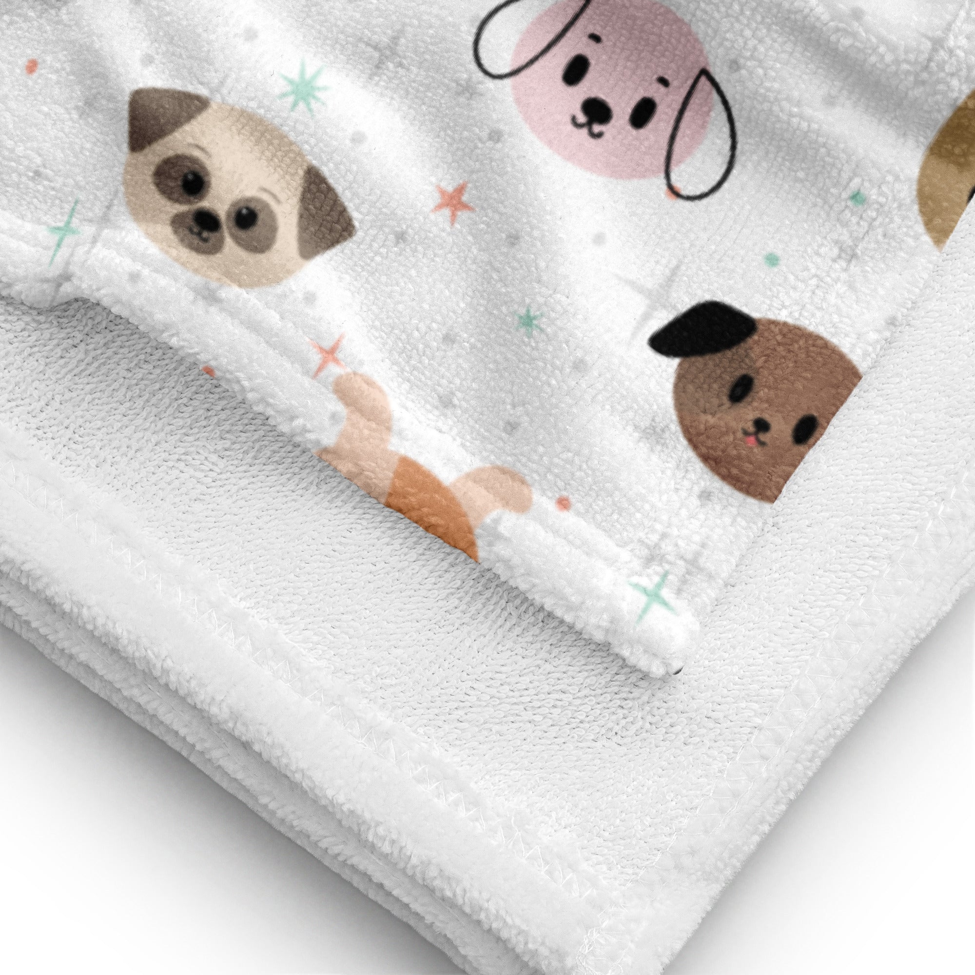 White plush kids dog face towel with beige pink and brown cartoon dog pattern and scattered star accents