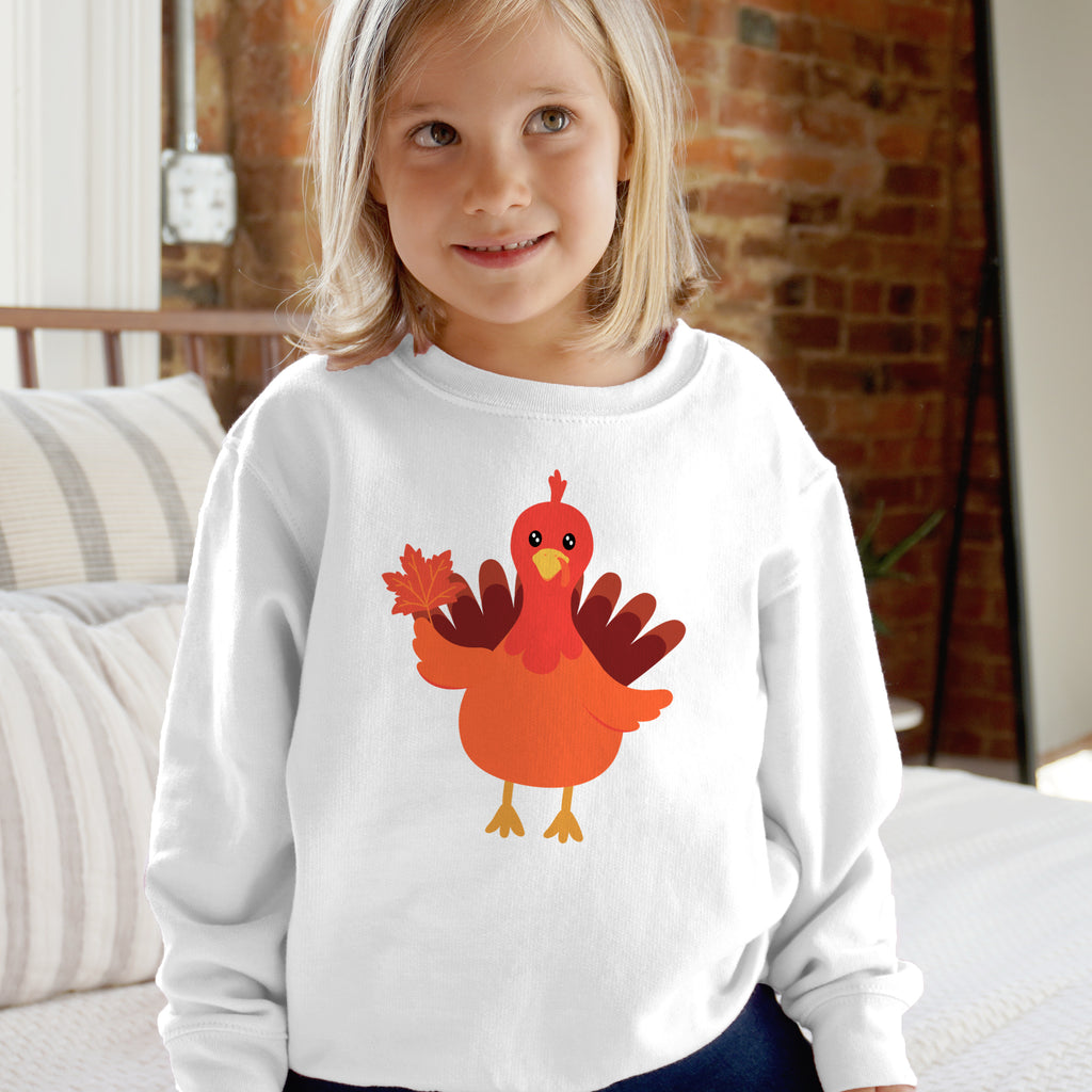 White long-sleeved kids sweatshirt with cartoon turkey holding a maple leaf for fall thanksgiving wear