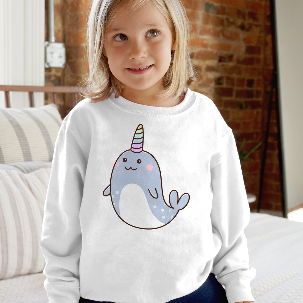 White kids long-sleeved sweatshirt featuring a cute cartoon narwhal with rainbow horn and polka dot body