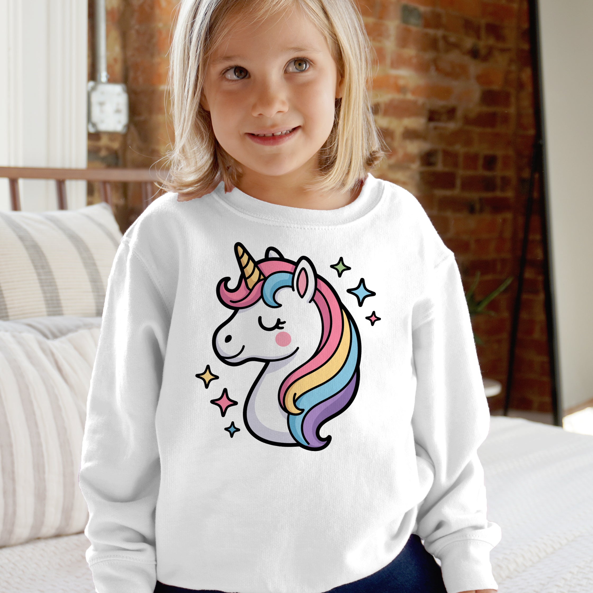White long-sleeved girls sweatshirt with colorful cartoon rainbow unicorn and stars in cute pastel design