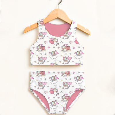 Girls unicorn birthday two piece swimsuit in white and pink with cartoon unicorns hearts gifts pattern and upf 50+ protection